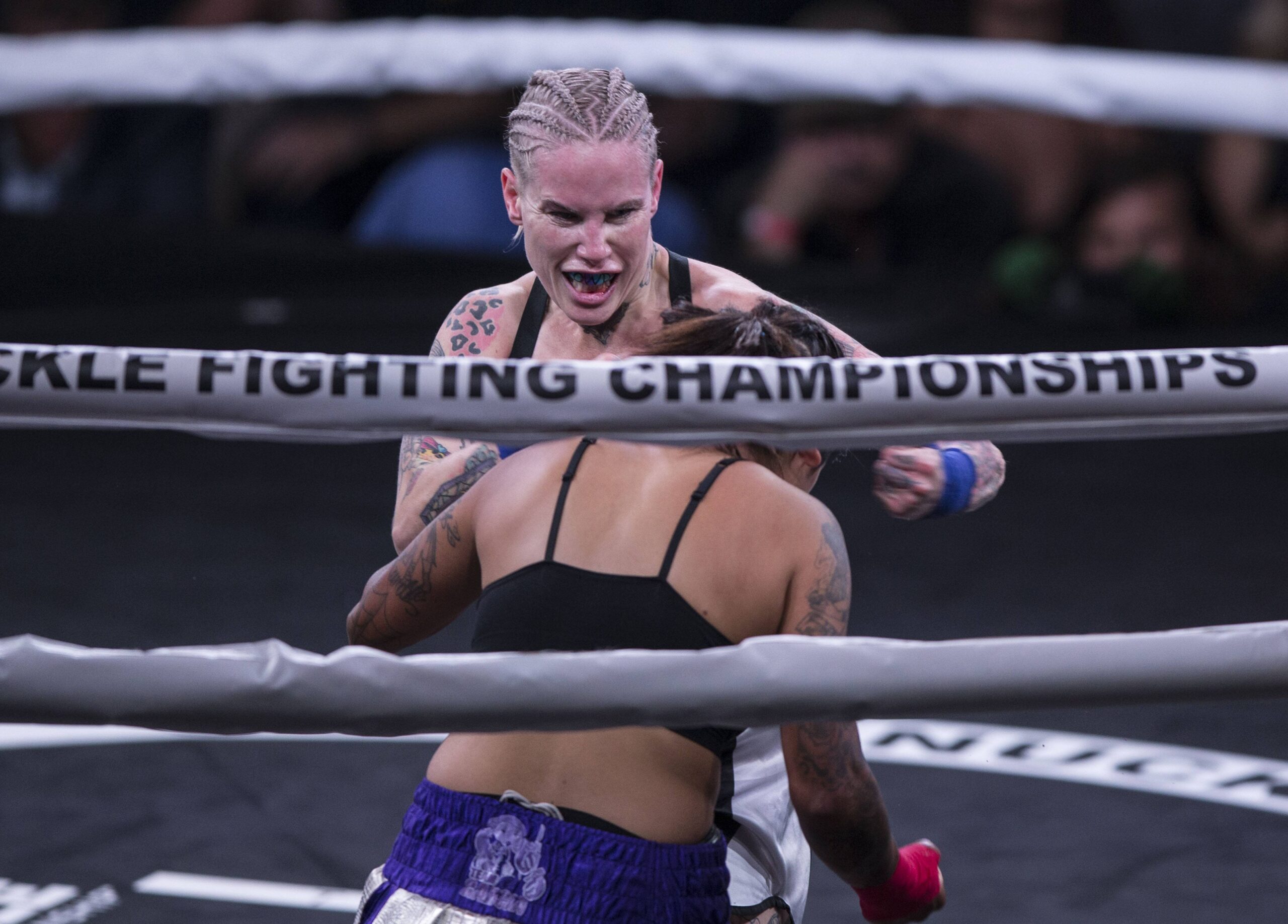 BKFC 41: Christine Ferea ducks a punch from Bec Rawlings