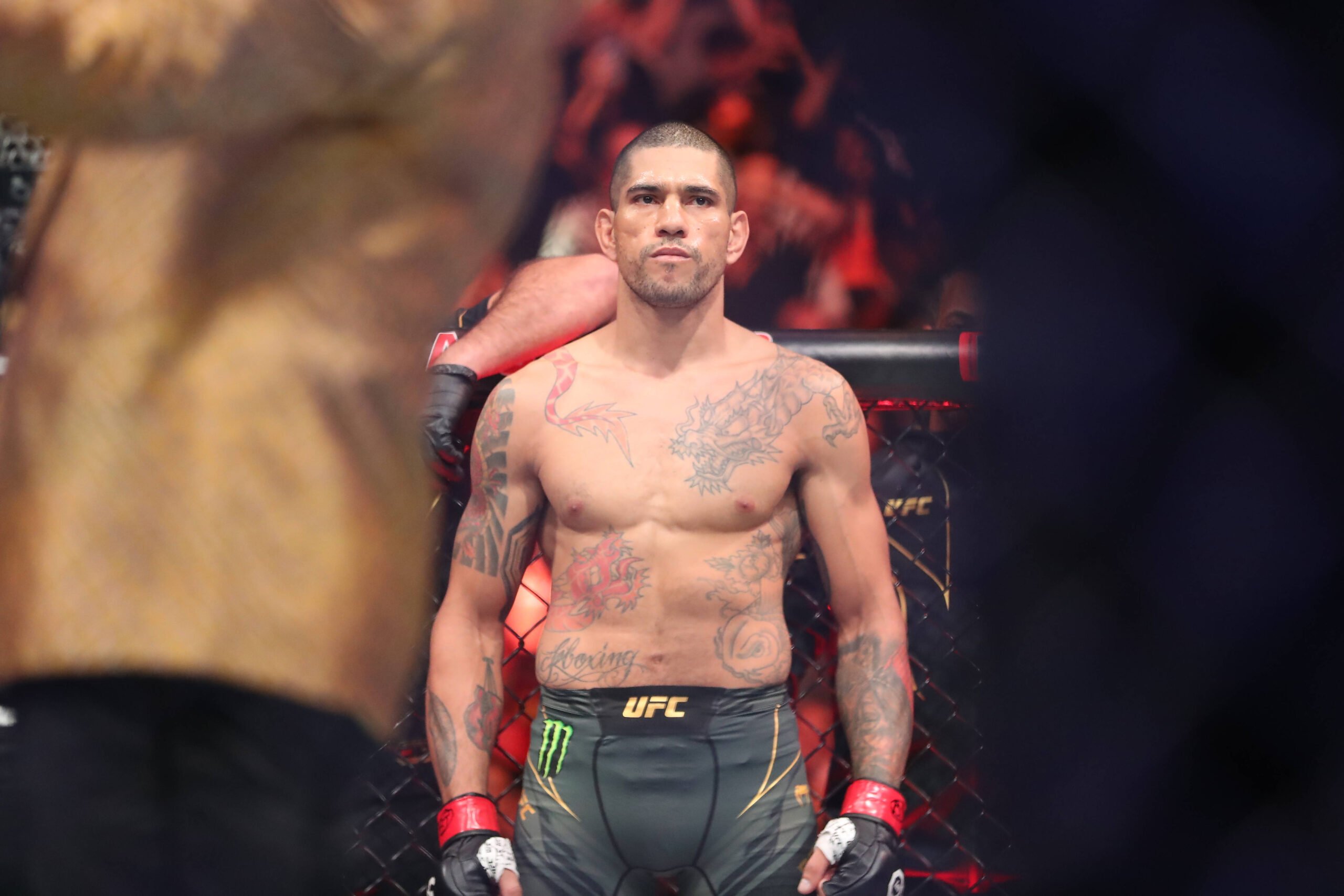 Alex Pereira stands across the Octagon from Israel Adesanya at UFC 287.