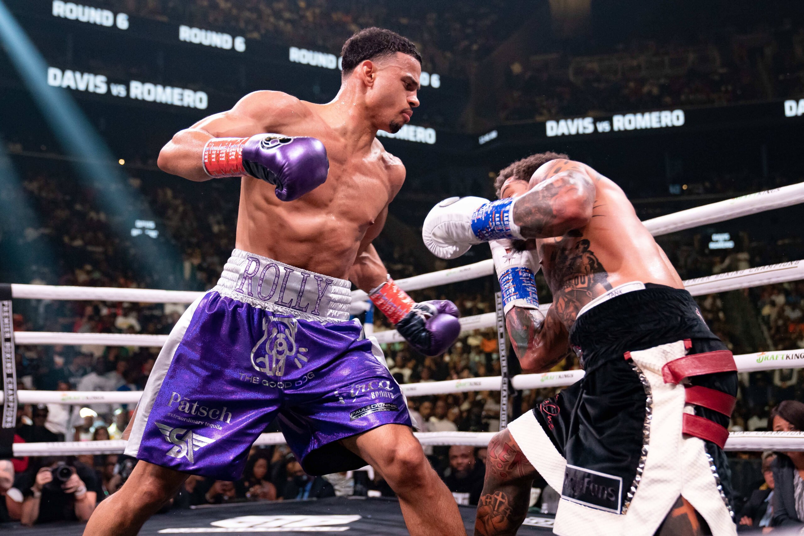 Boxer Rolando Romero throws a punch during his fight.