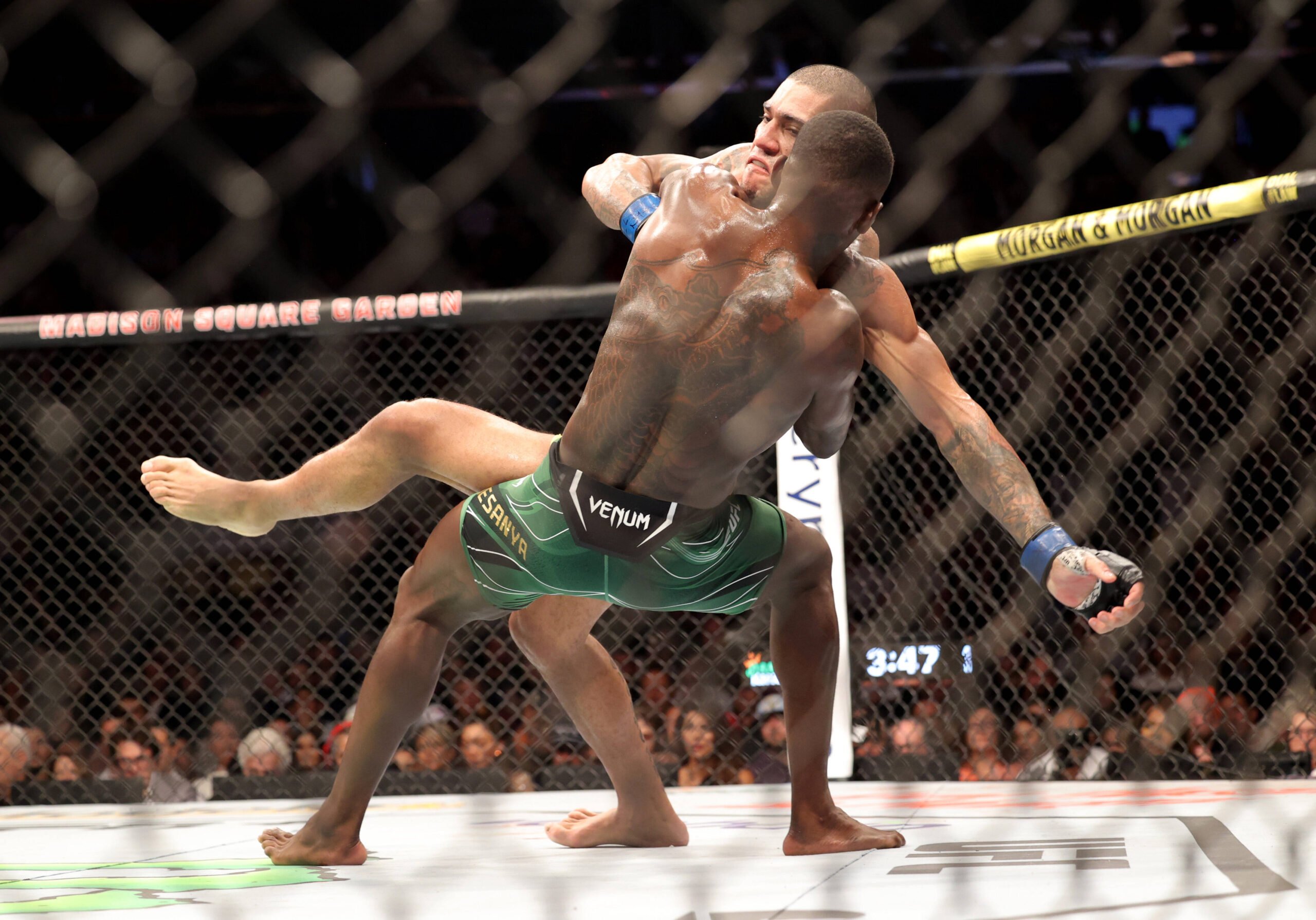 Israel Adesanya takes down Alex Pereira at UFC 281.