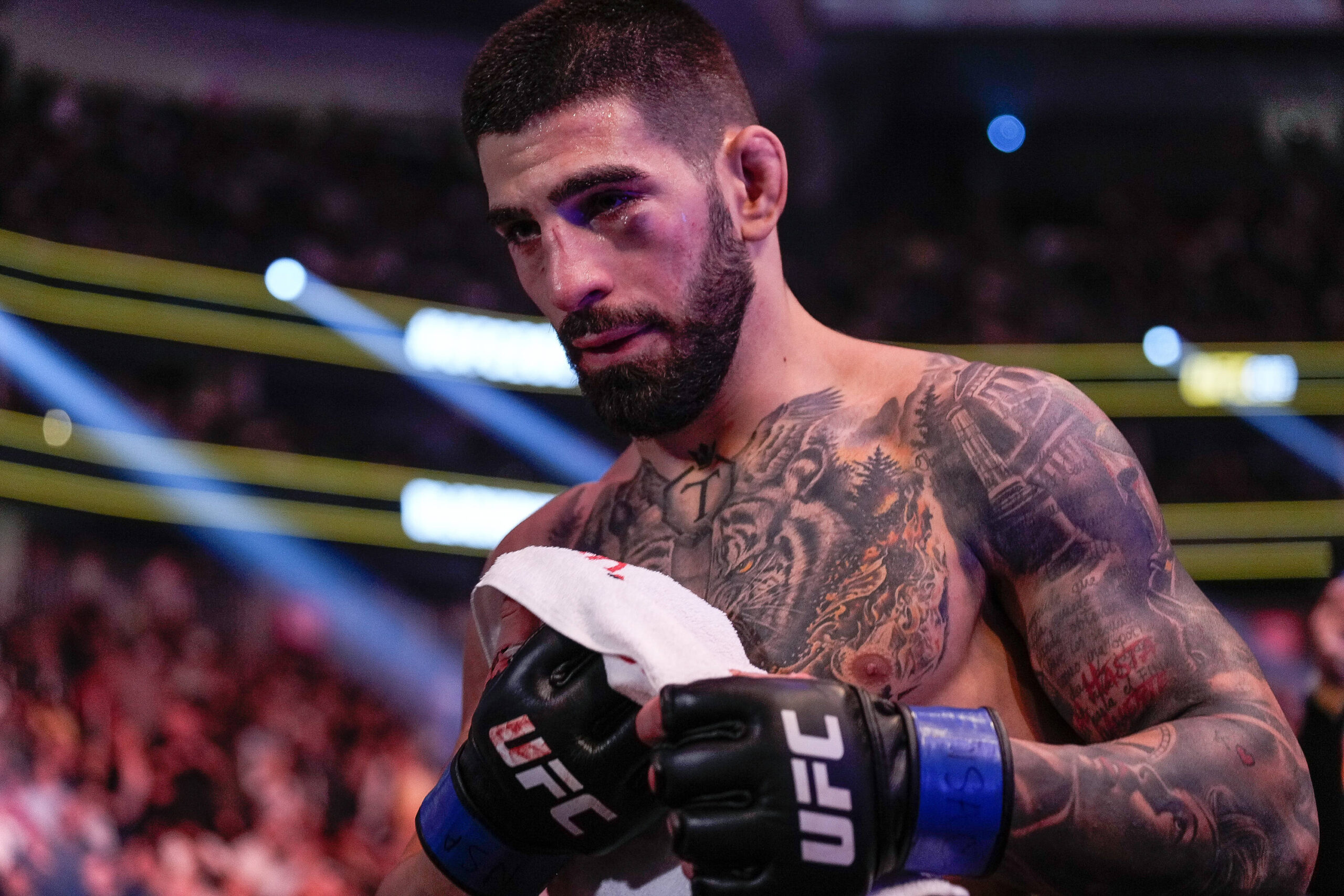 UFC featherweight Ilia Topuria exits the cage.