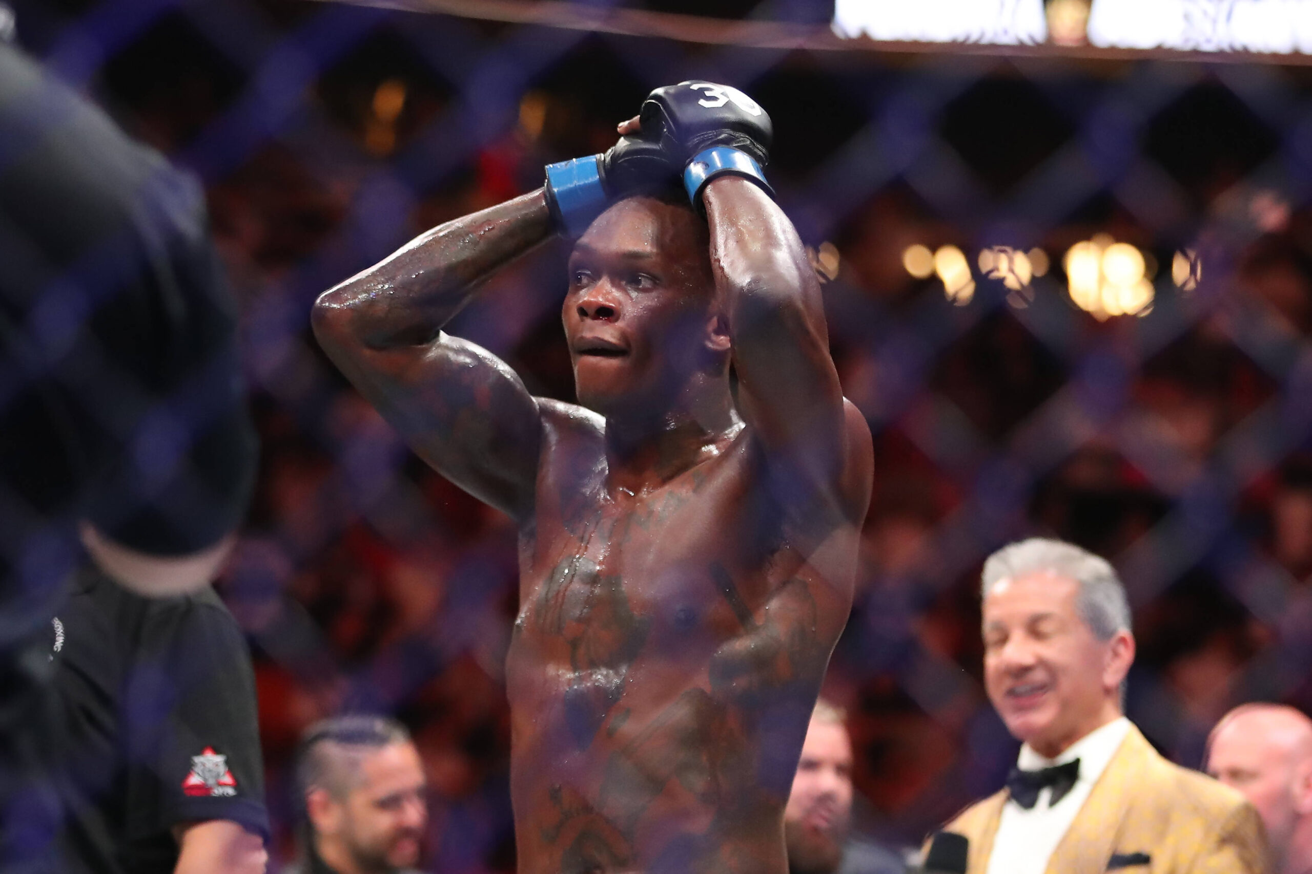 Israel Adesanya can't believe what Sean O'Malley is saying.