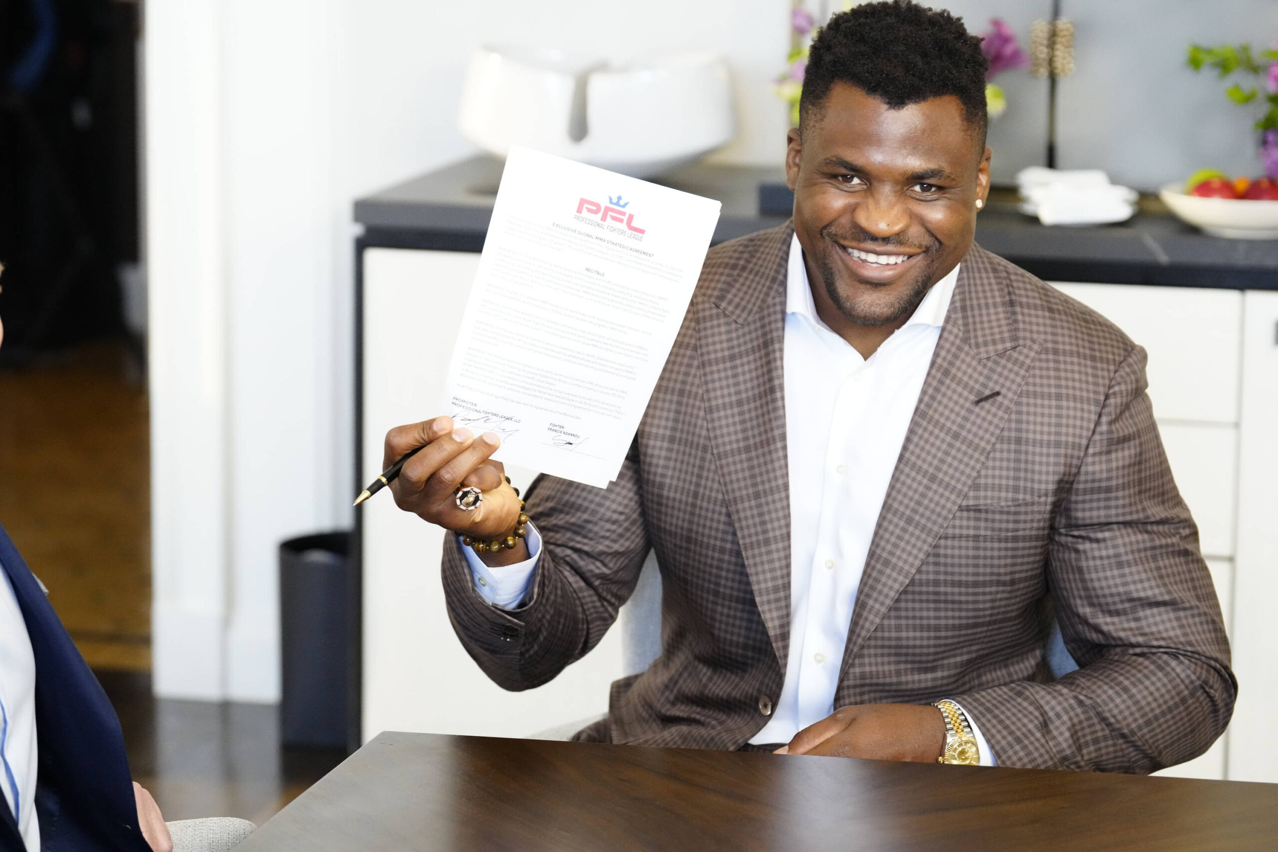 Francis Ngannou shows off his new contract with PFL free of Dana White.