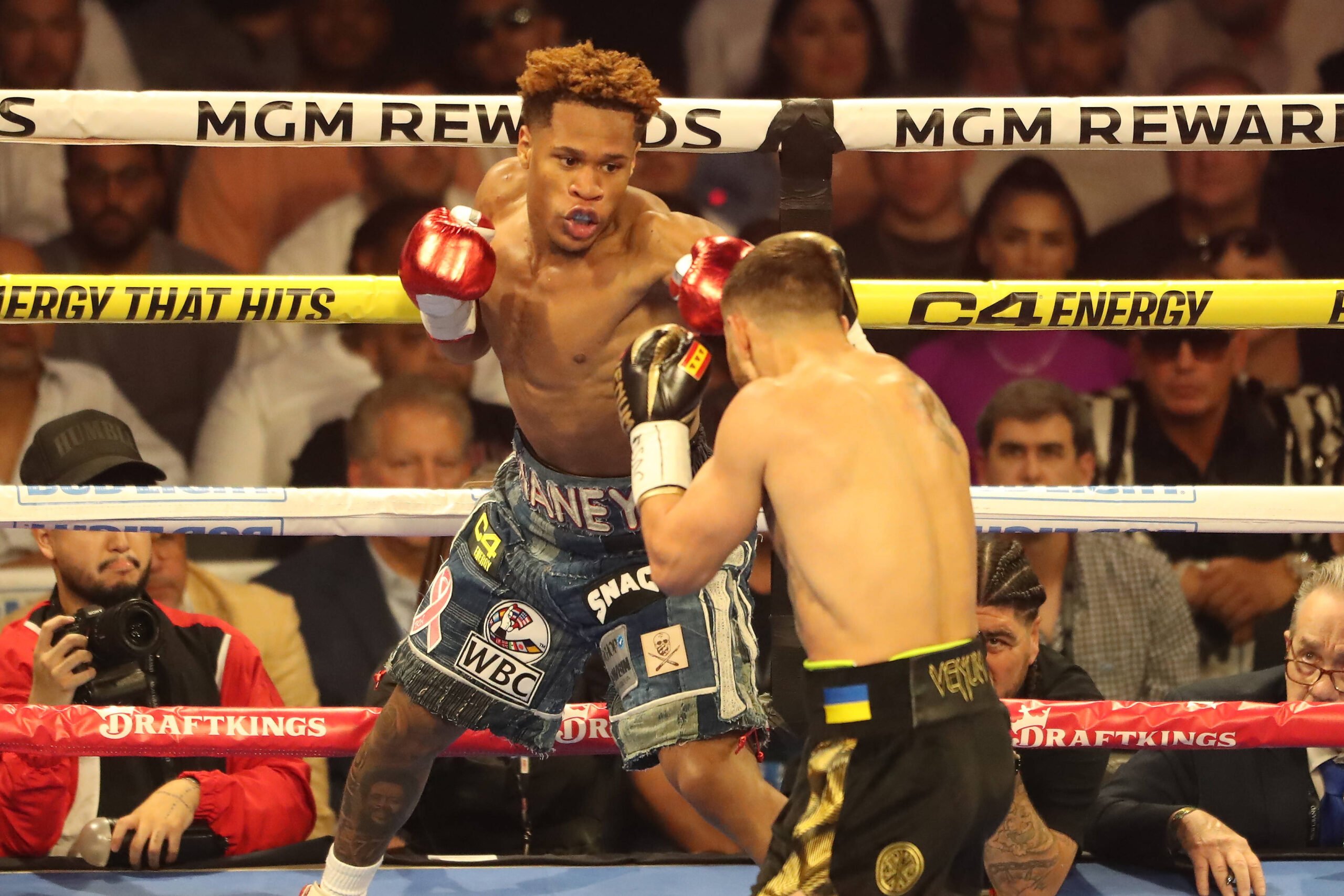 Devin Haney and Vasiliy Lomachenko exchange in their title fight