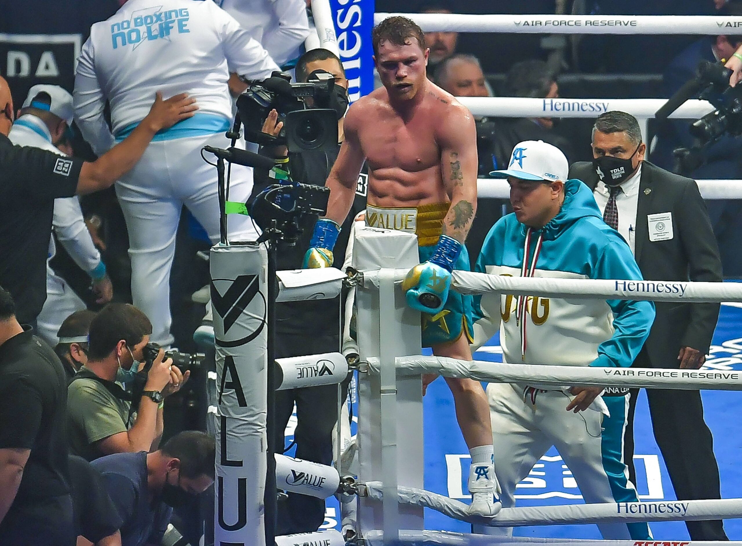 Canelo Alvarez poses on the ring post.