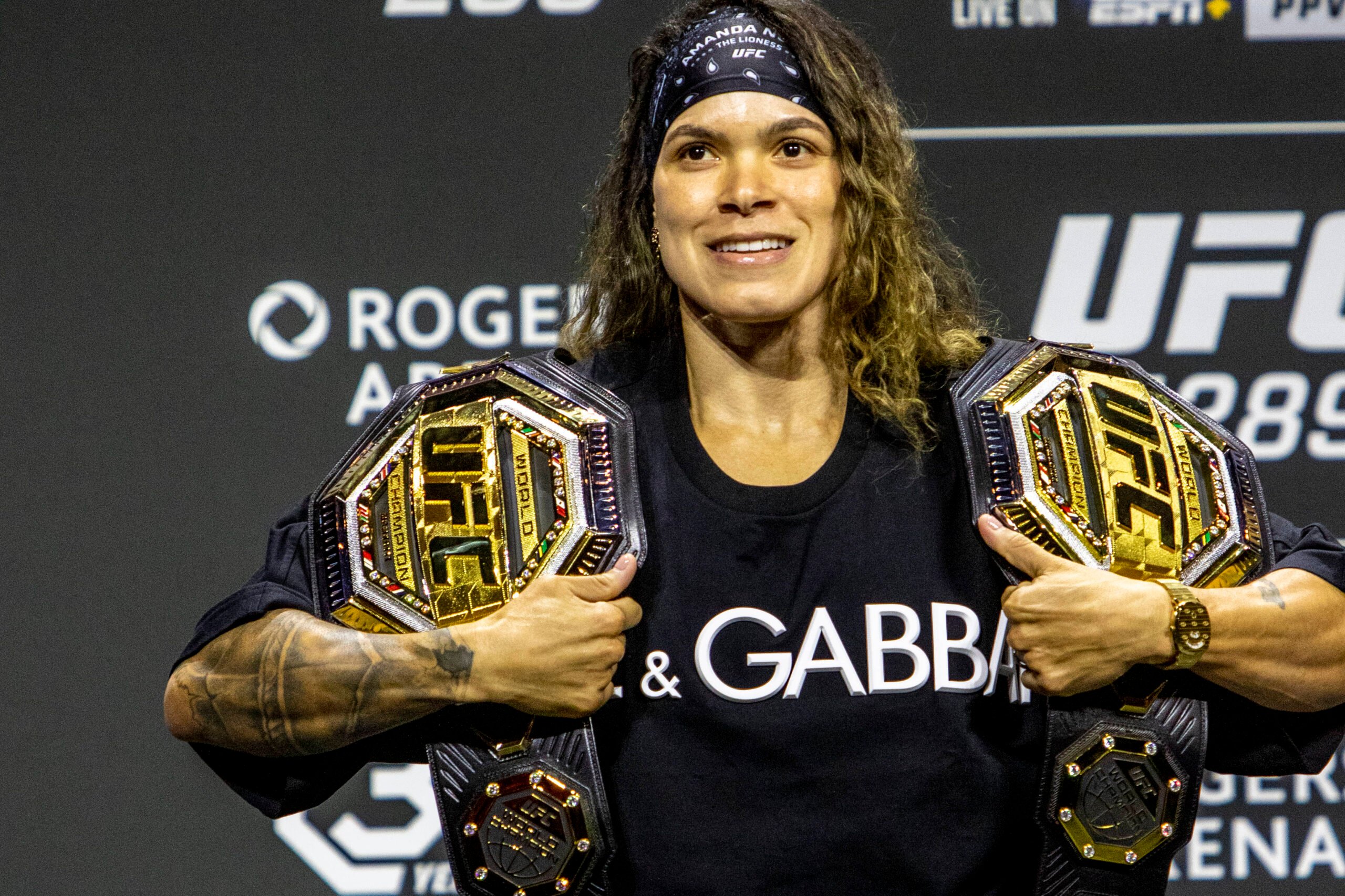 Amanda Nunes poses for photos with her two UFC belts after the UFC 289 press conference, PK, Pressekonferenz at Rogers Arena on June 08,2023, in Va...