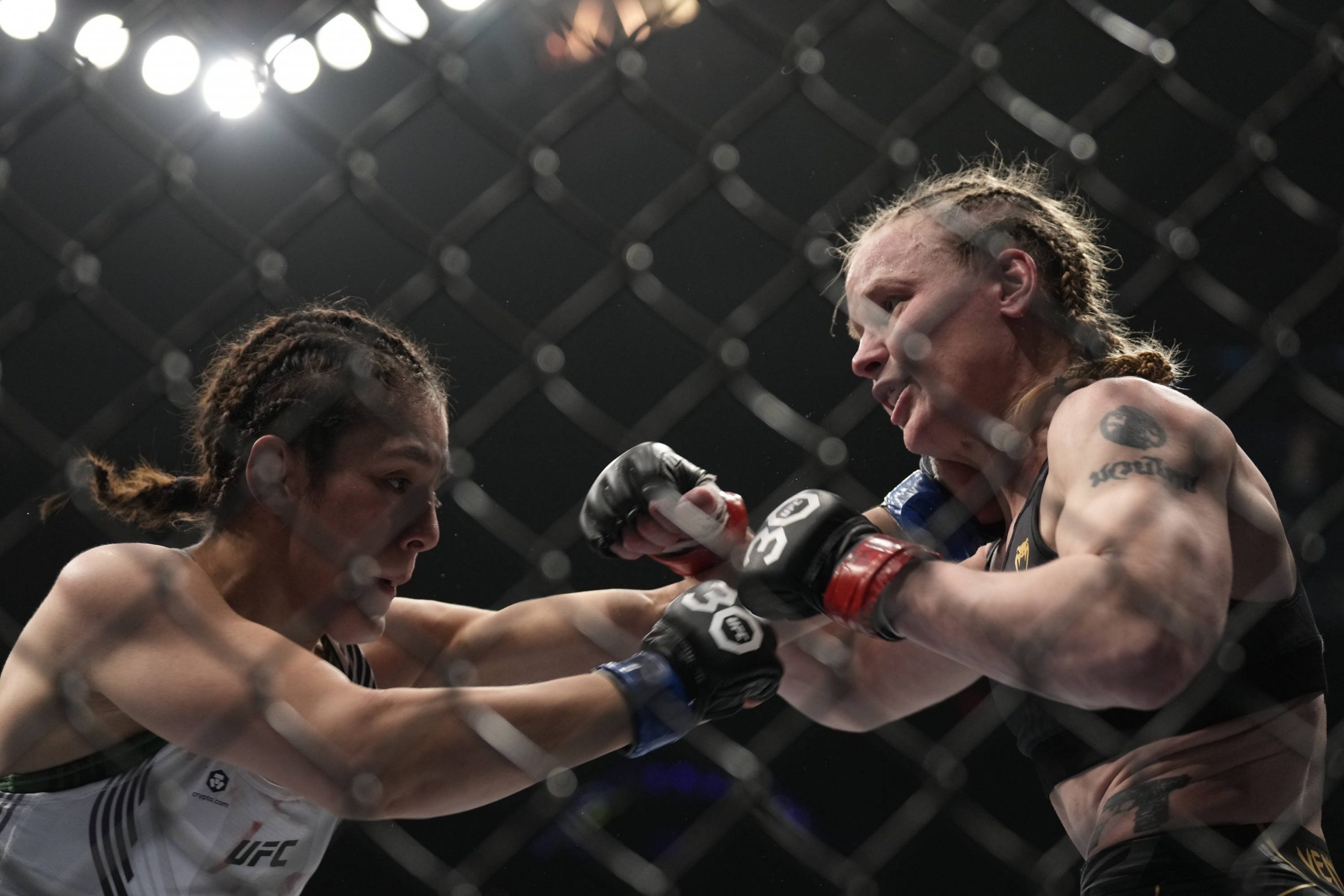Alexa Grasso punches Valentina Shevchenko at UFC 285.