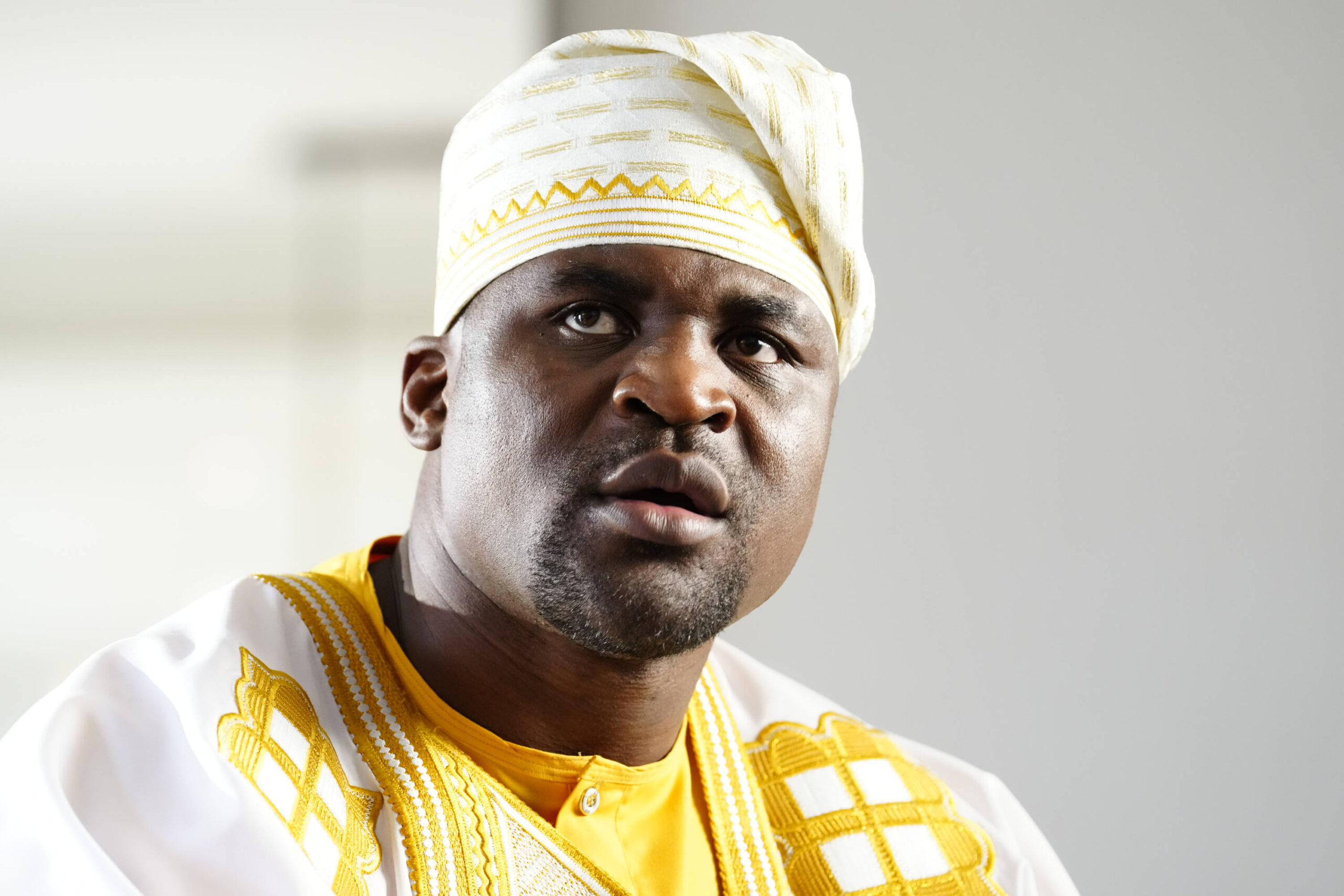 Francis Ngannou wearing tradfitional African wardrobe at Professional Fighters League - Francis Ngannou workout at Unbreakable Performance Center o...