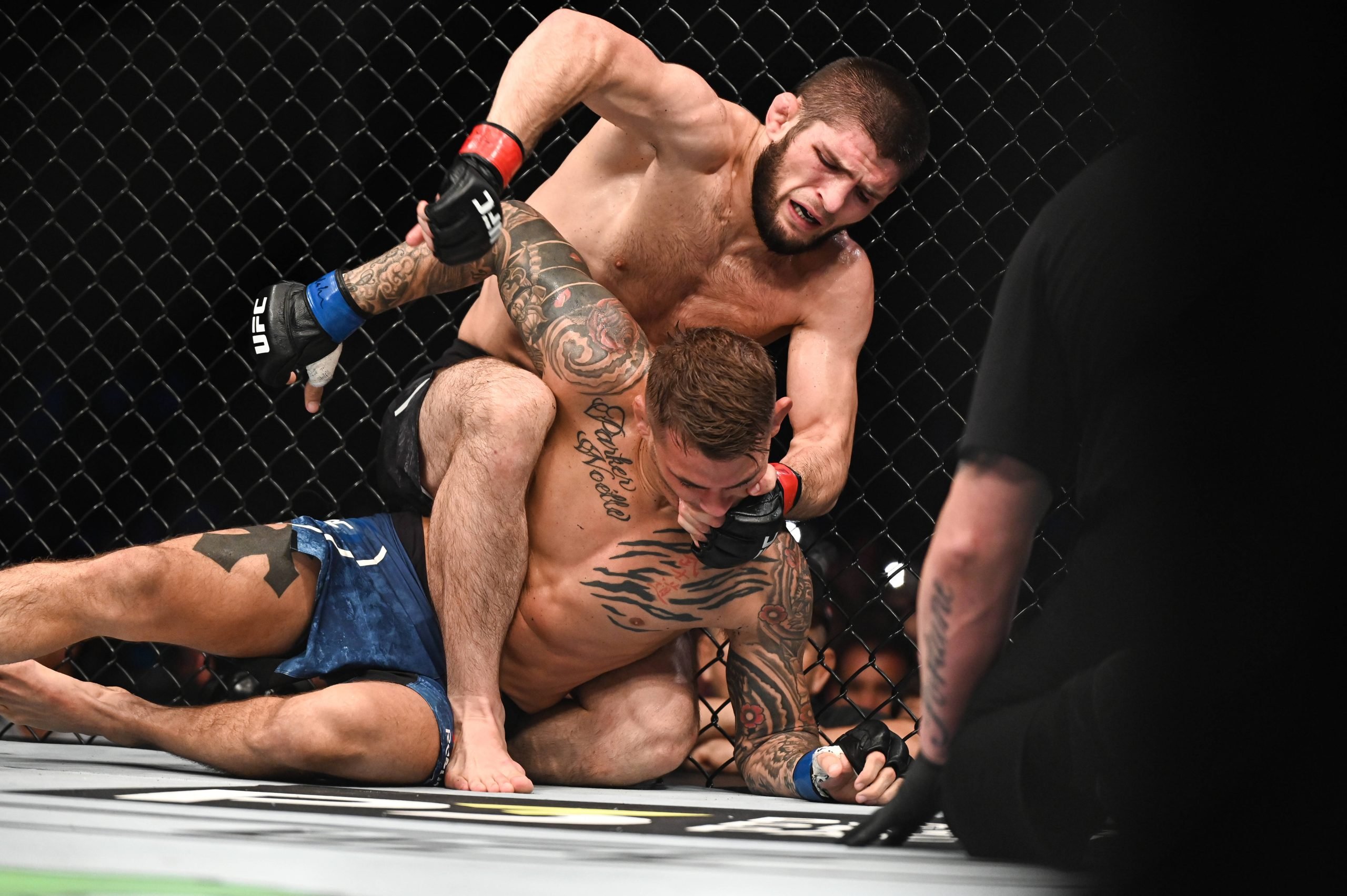 Khabib Nurmagomedov punches Dustin Poirier from mount position in a UFC fight