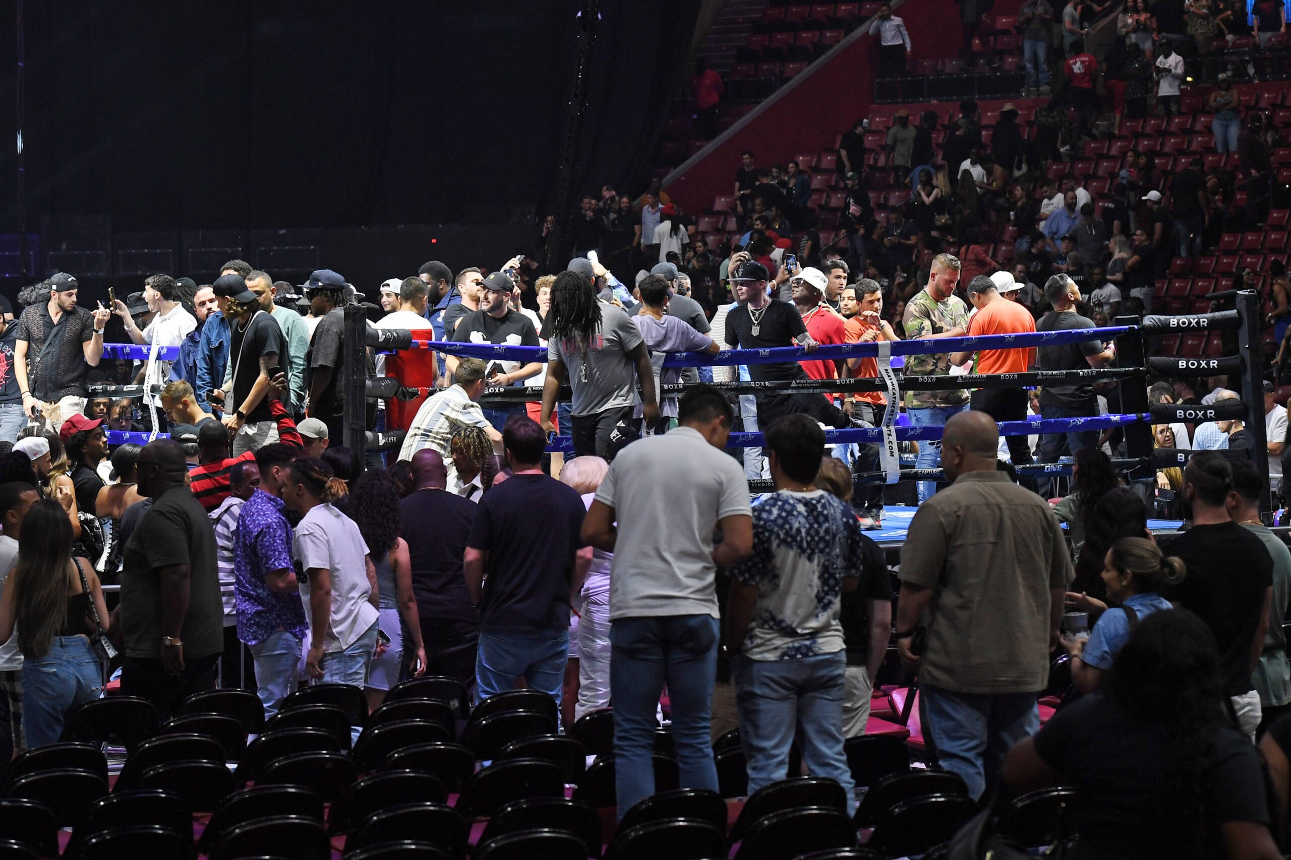 SUNRISE FL - JUNE 11: The fight was stopped early, as chaos erupts after both camps got involved and fans entered the ring during Floyd Mayweather ...