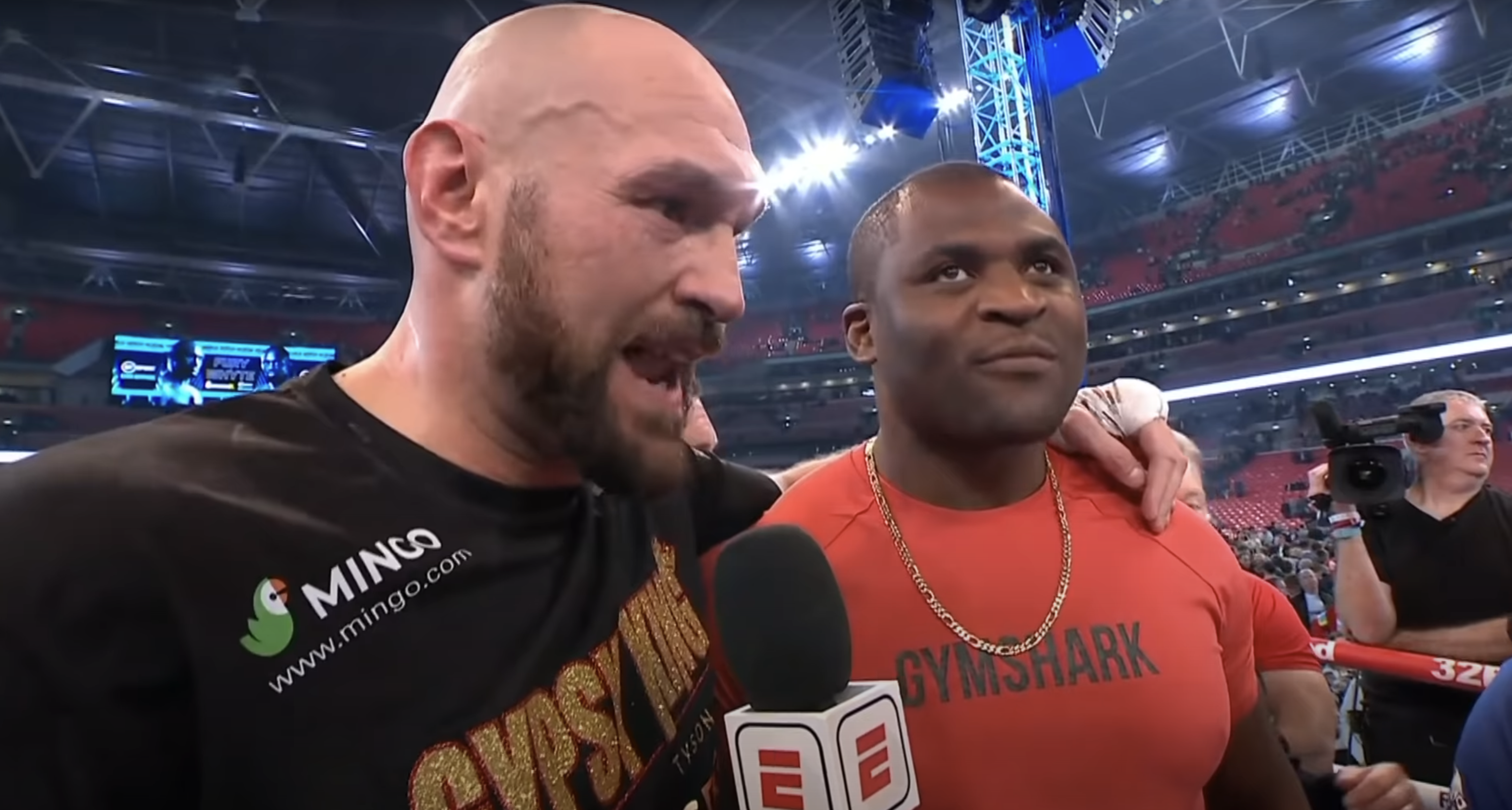 Boxing champ Tyson Fury and UFC star Francis Ngannou hype up a crossover fight.