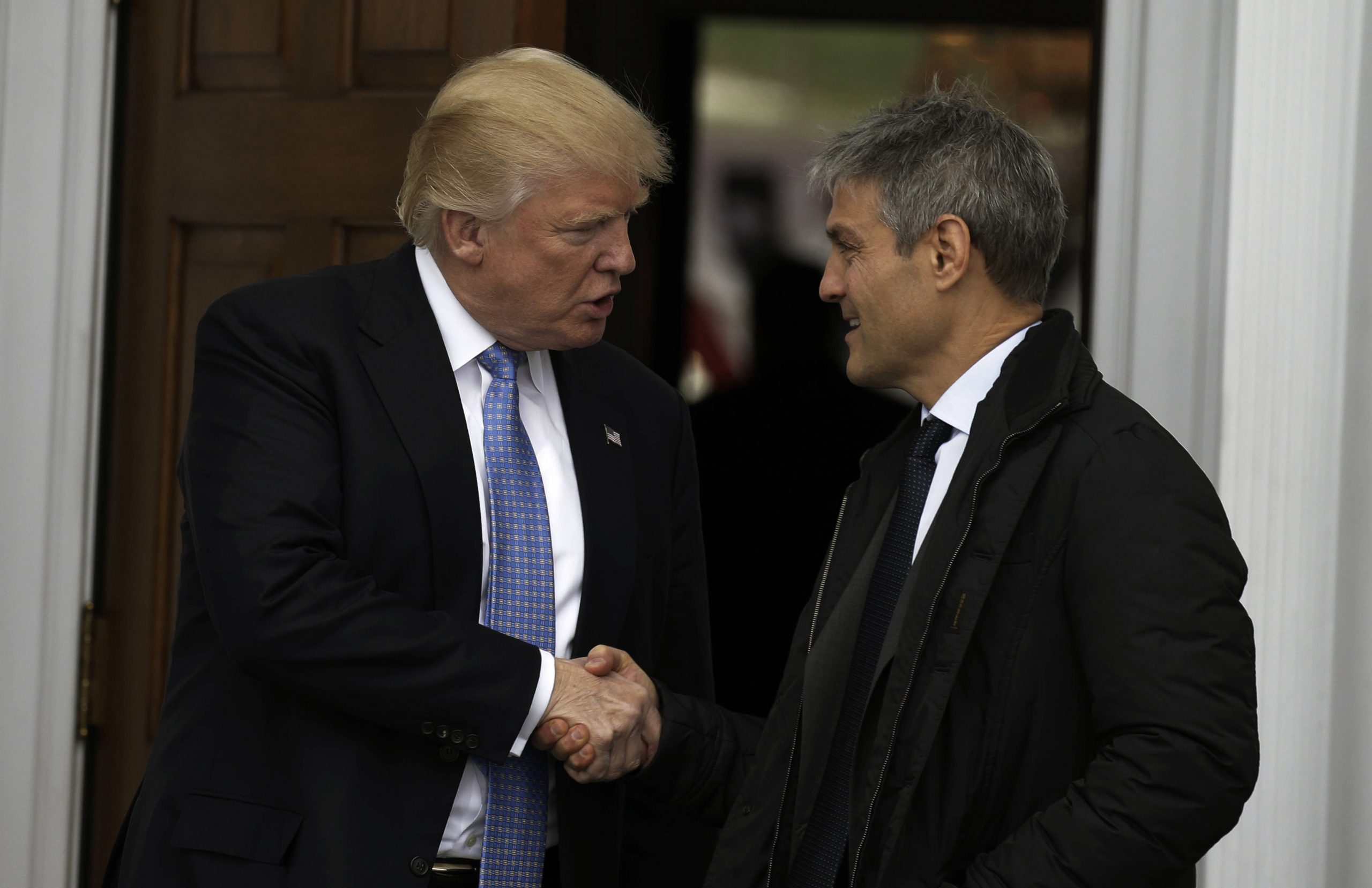 Donald Trump At Trump International Golf Club US President-elect Donald Trump (L) shakes hands with Ari Emanuel at the c