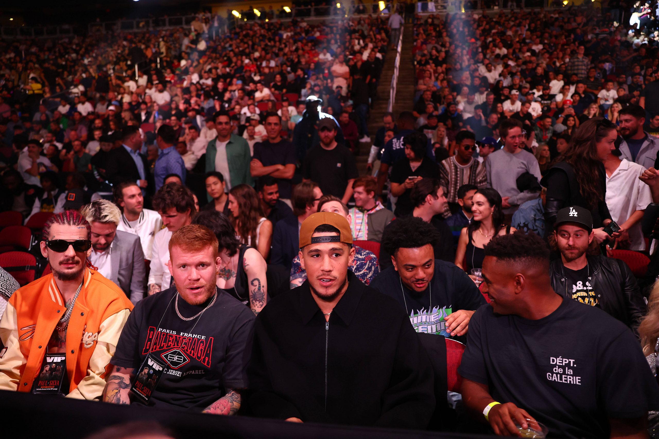 NBA player Devin Booker and UFC fighter Sean O'Malley (left) attend the fight between Jake Paul and Anderson Silva at Desert Diamond Arena