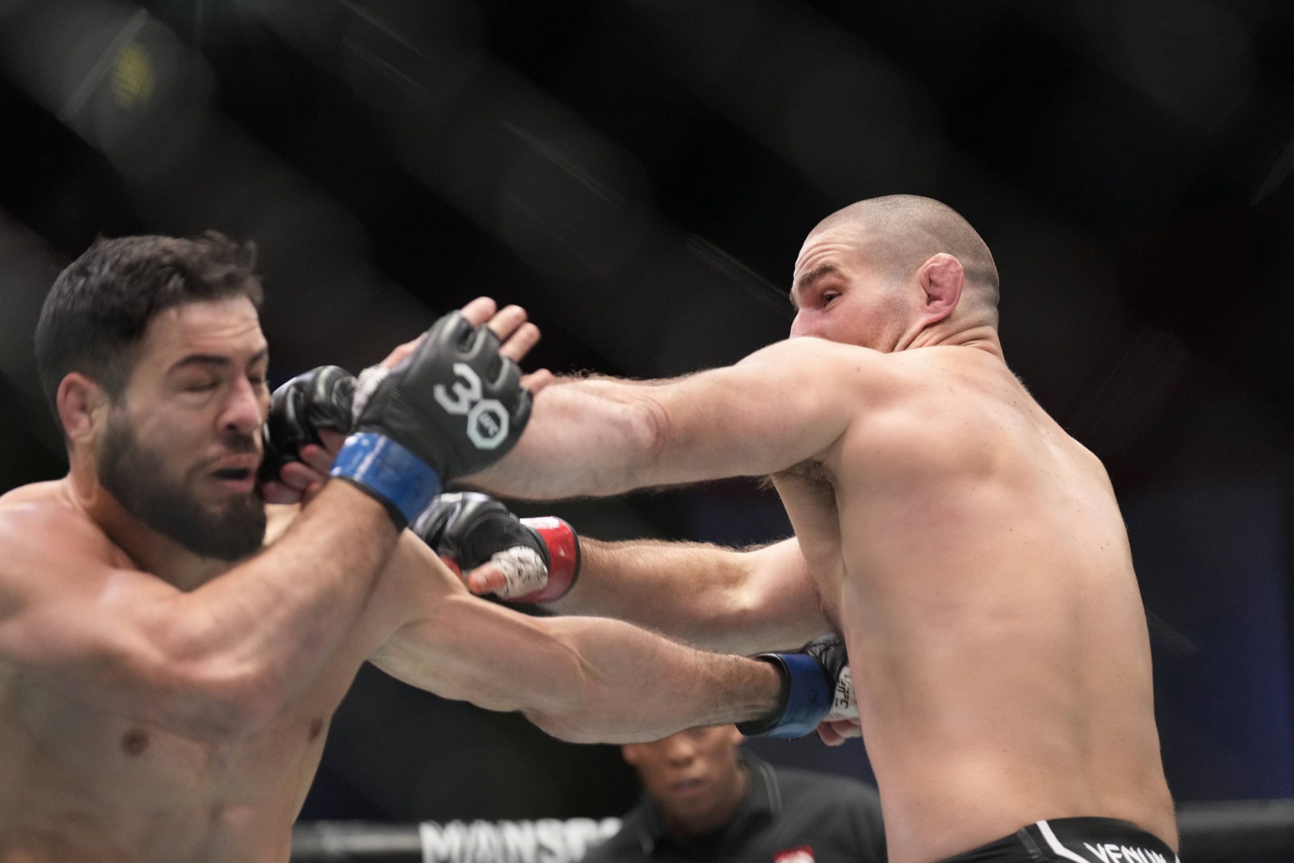January 14, 2023, Las Vegas, NV, LAS VEGAS, NV, United States: LAS VEGAS, NV - JANUARY 14: (R-L) Sean Strickland punches Nassourdine Imavov in thei...