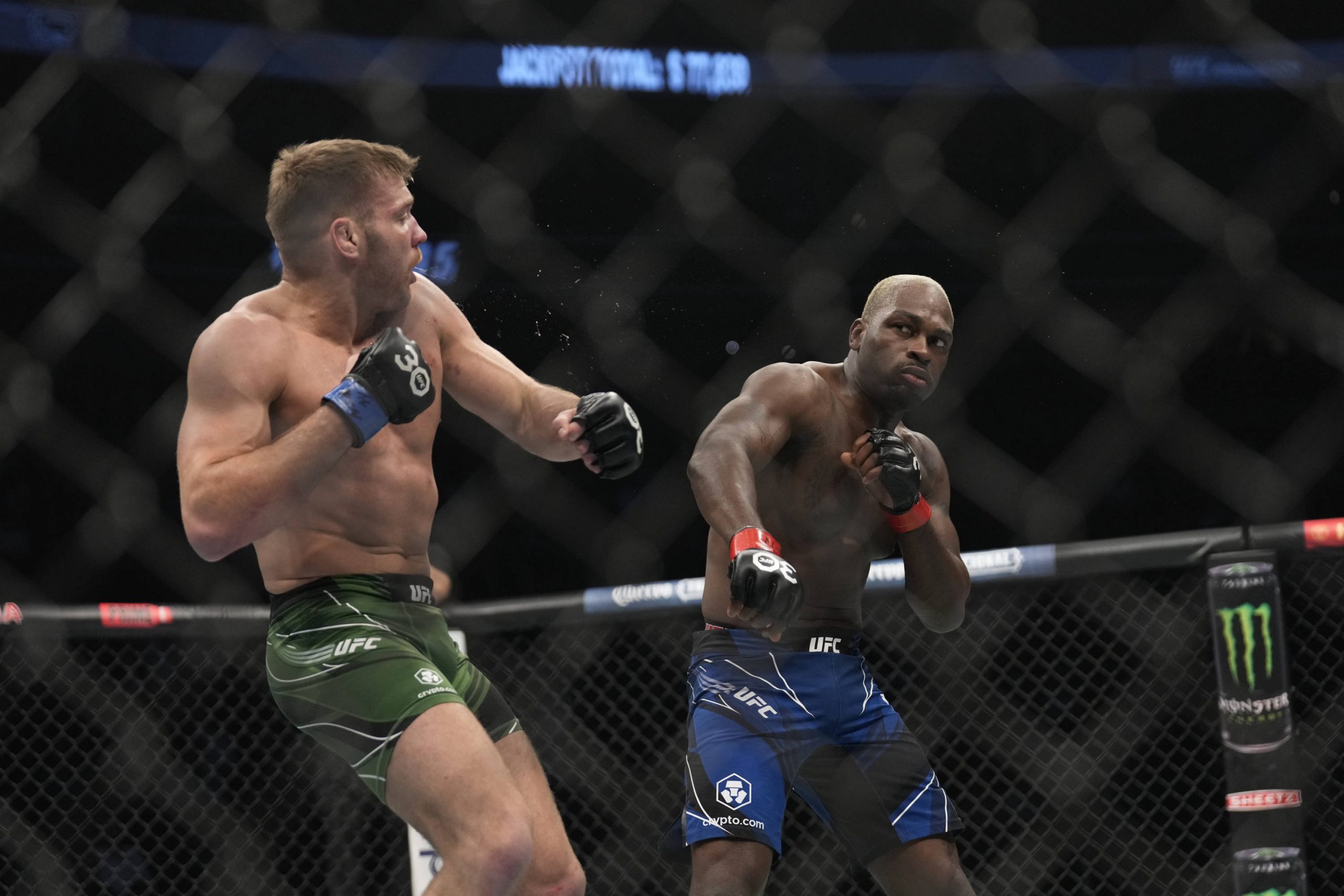 March 4, 2023, Las Vegas, NV, LAS VEGAS, NV, USA: LAS VEGAS, NV - MARCH 4: (R-L) Derek Brunson punches Dricus Du Plessis in their Lightweight fight...