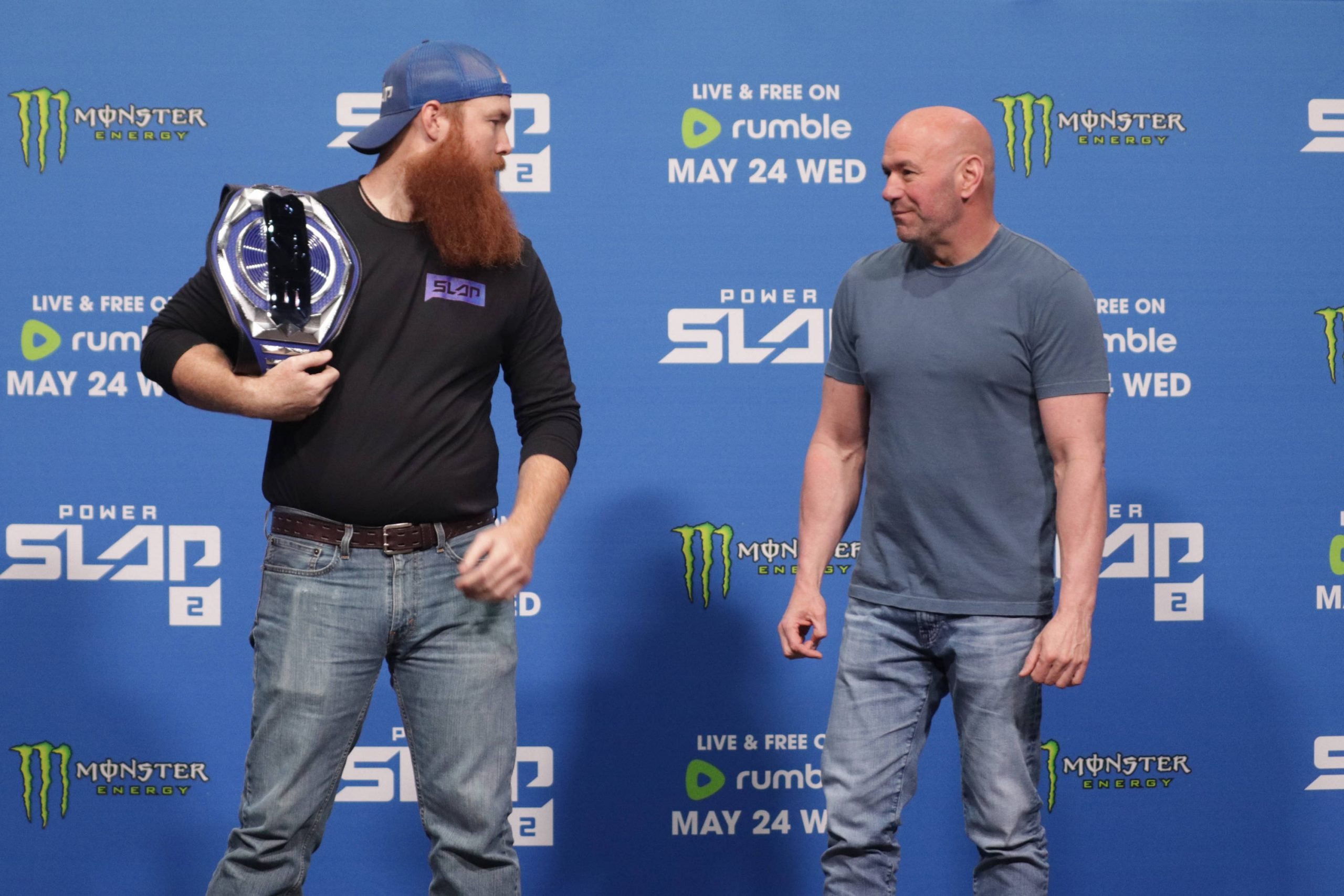 Dana White poses with a Power Slap champ.