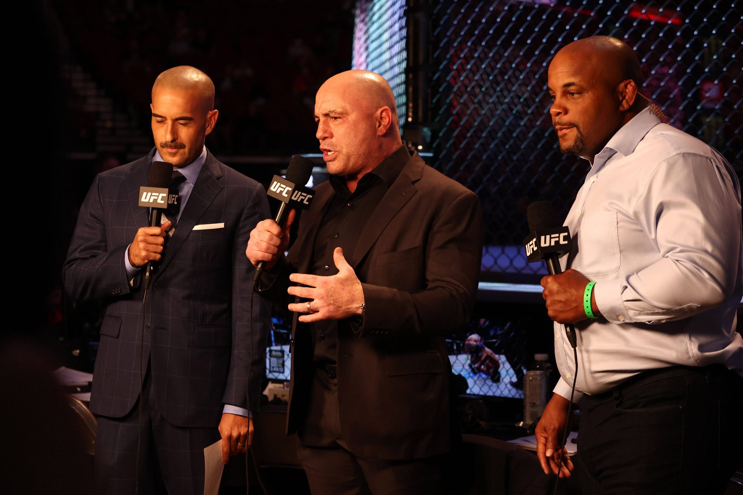 UFC 291 commentary team of Joe Rogan, Jon Anik and Daniel Cormier.