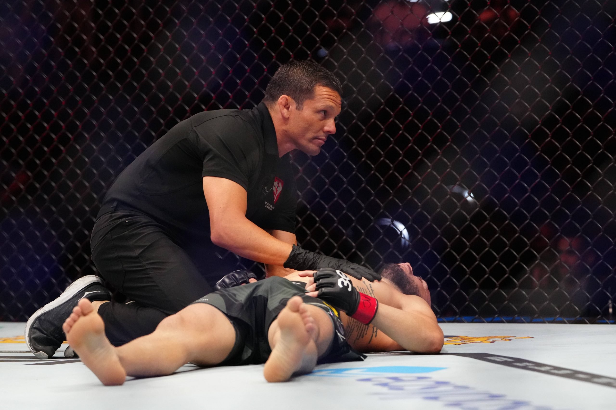 MMA: UFC 290 Ross vs Aguilar Jul 8, 2023; Las Vegas, Nevada, USA; Shannon Ross (red gloves) is examined by medical professional after the fight aga...