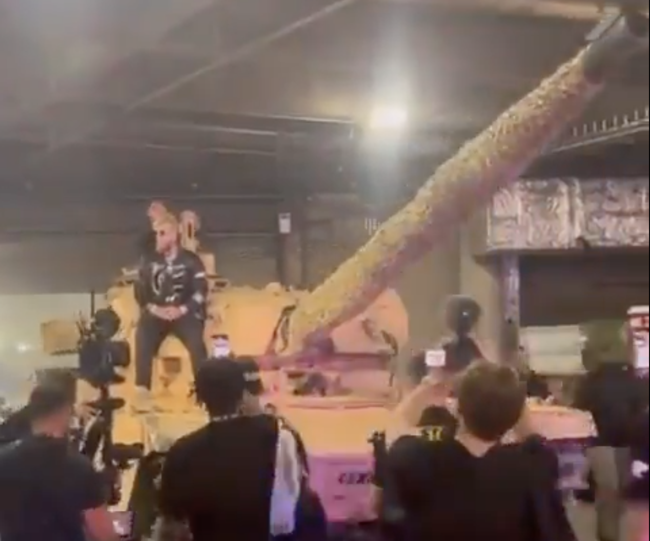Jake Paul arrives for his bout against Nate Diaz at the American Airlines Center in Dallas, Texas on a tank.