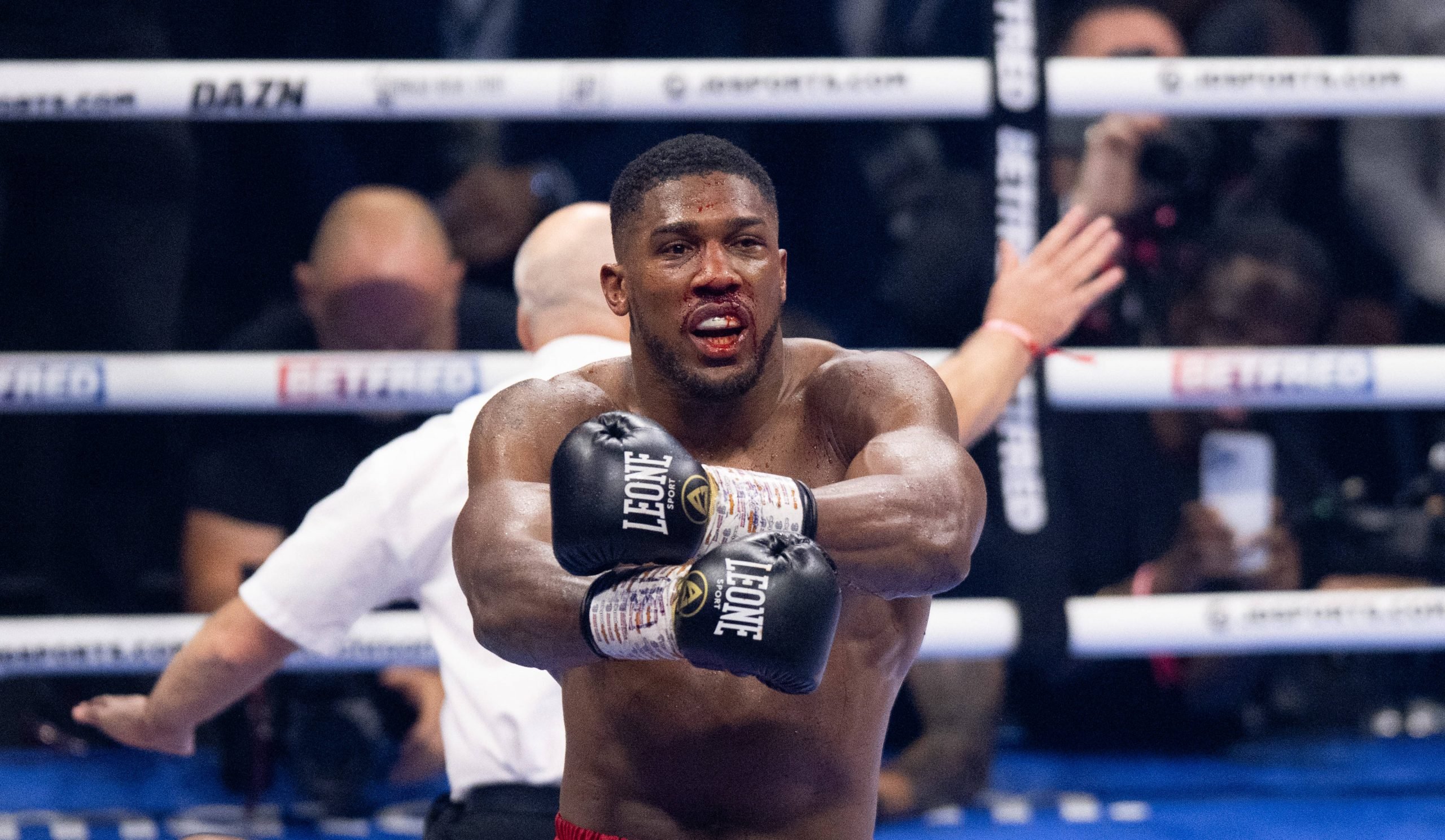Anthony Joshua ( red shorts) knocks out Robert Helenius ( white blue shorts) during their International Heavyweight contest at the O2, London, Engl...