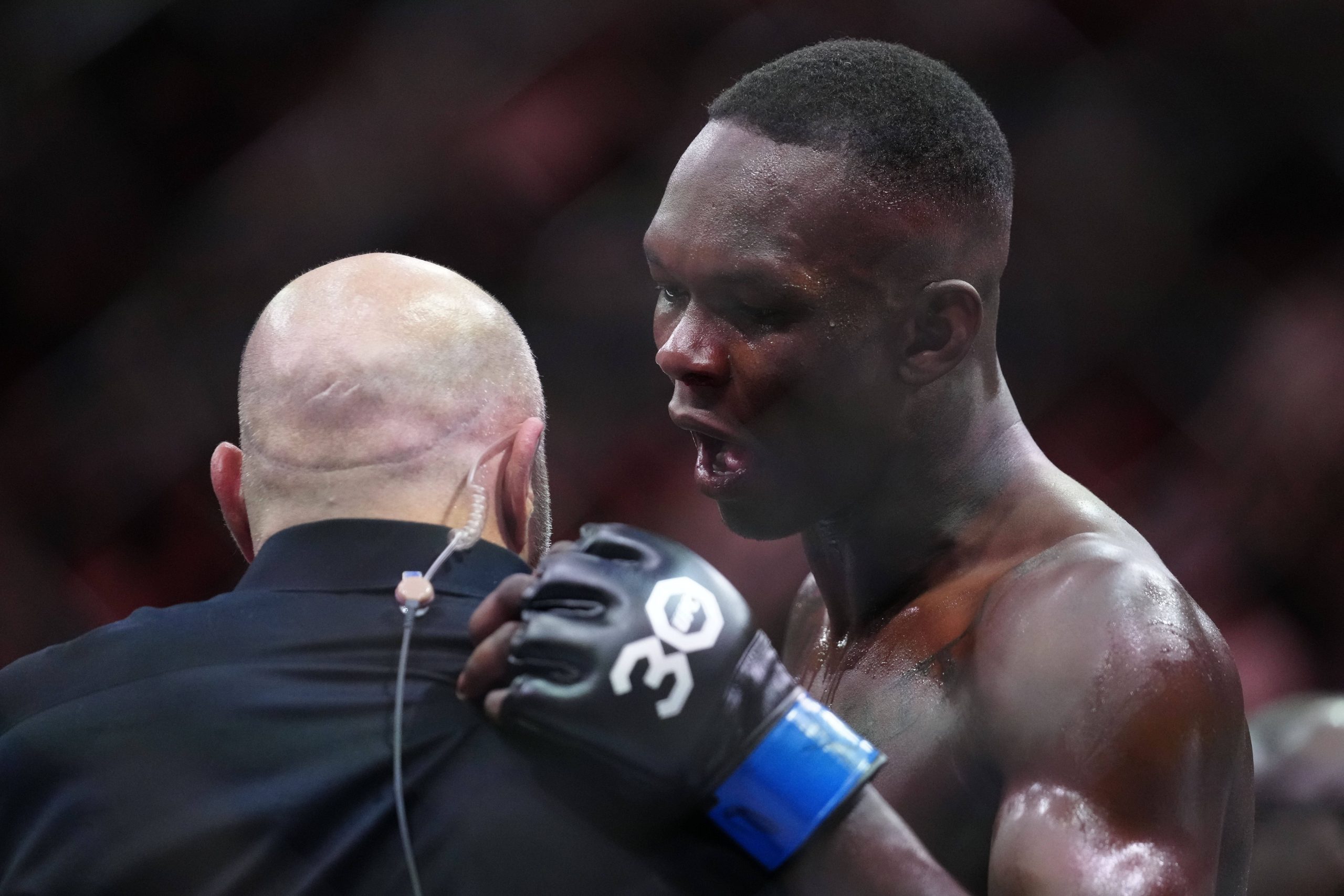 MMA: UFC 287 - Pereira vs Adesanya Apr 8, 2023; Miami, Florida, USA; Israel Adesanya (blue gloves) reacts to defeating Alex Pereira (red gloves) du...