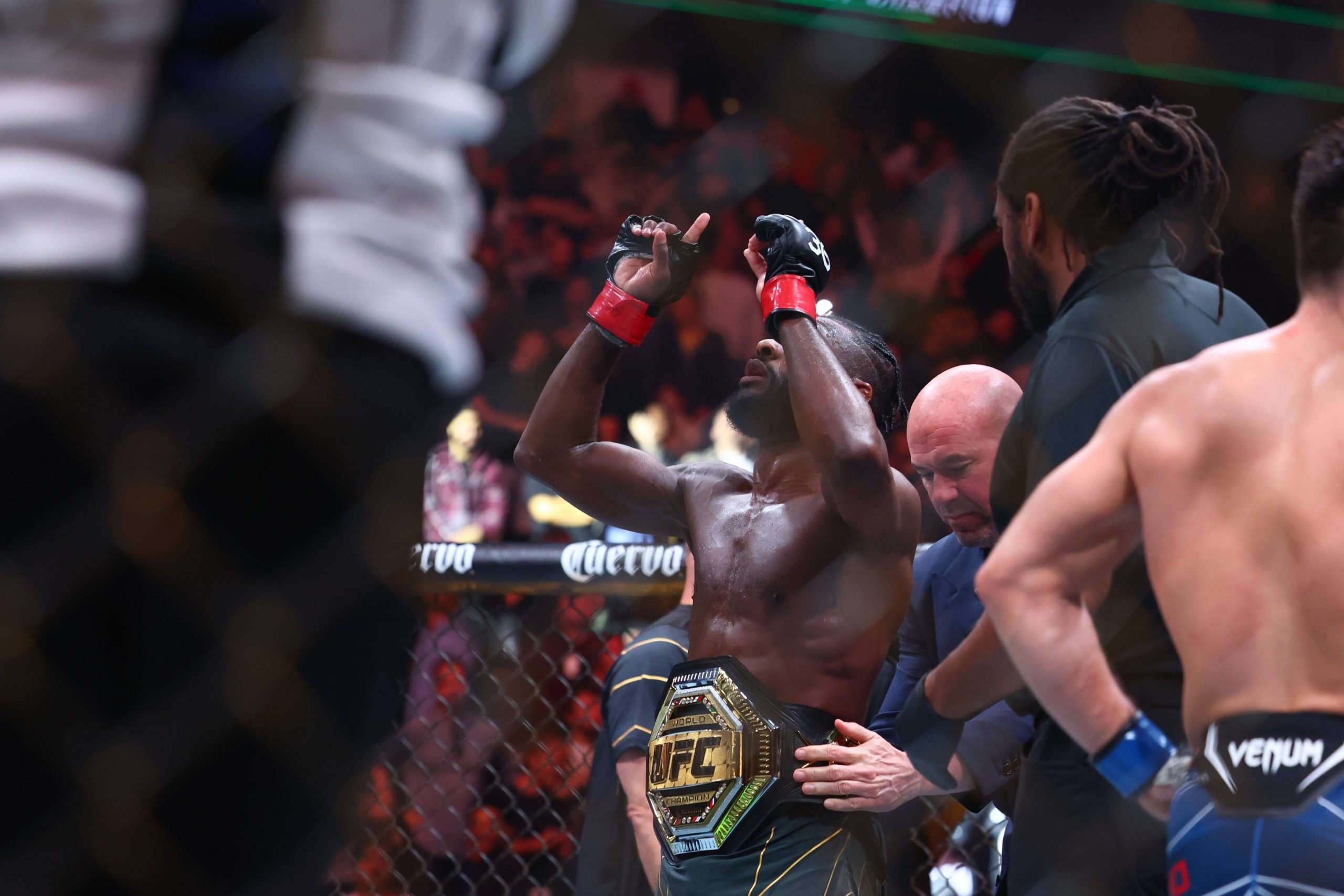 Aljamain Sterling celebrates his UFC championship.