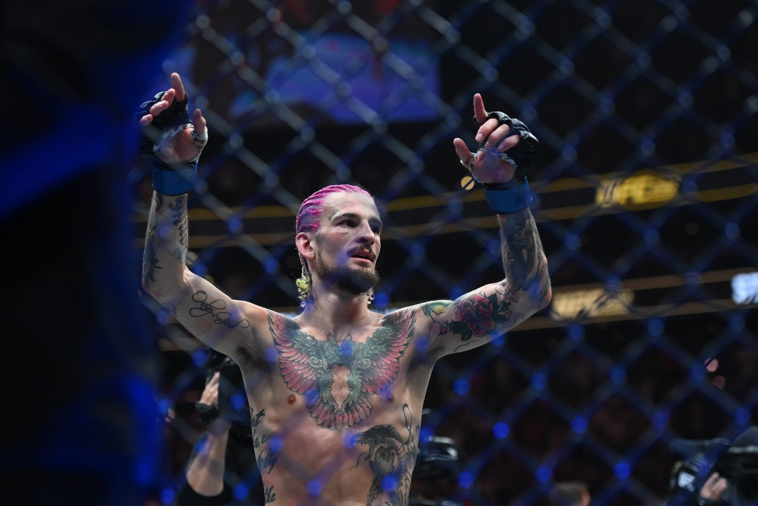 Sean O'Malley (blue gloves) reacts to defeating Aljamin Sterling (red gloves) during UFC 292 at TD Garden. Boston TD Garden MA USA, EDITORIAL USE O...
