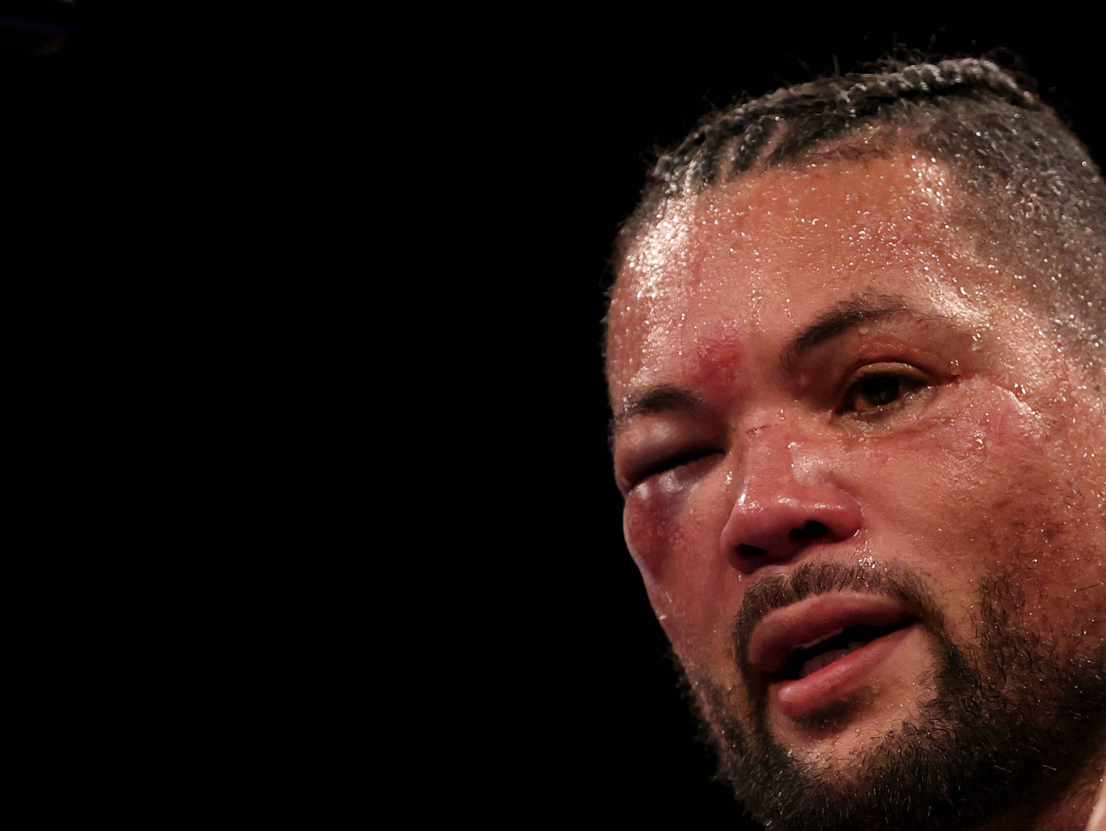 (230416) -- LONDON, April 16, 2023 -- Joe Joyce of Britain reacts after he was defeated by Zhang Zhilei of China in their WBO heavyweight interim t...