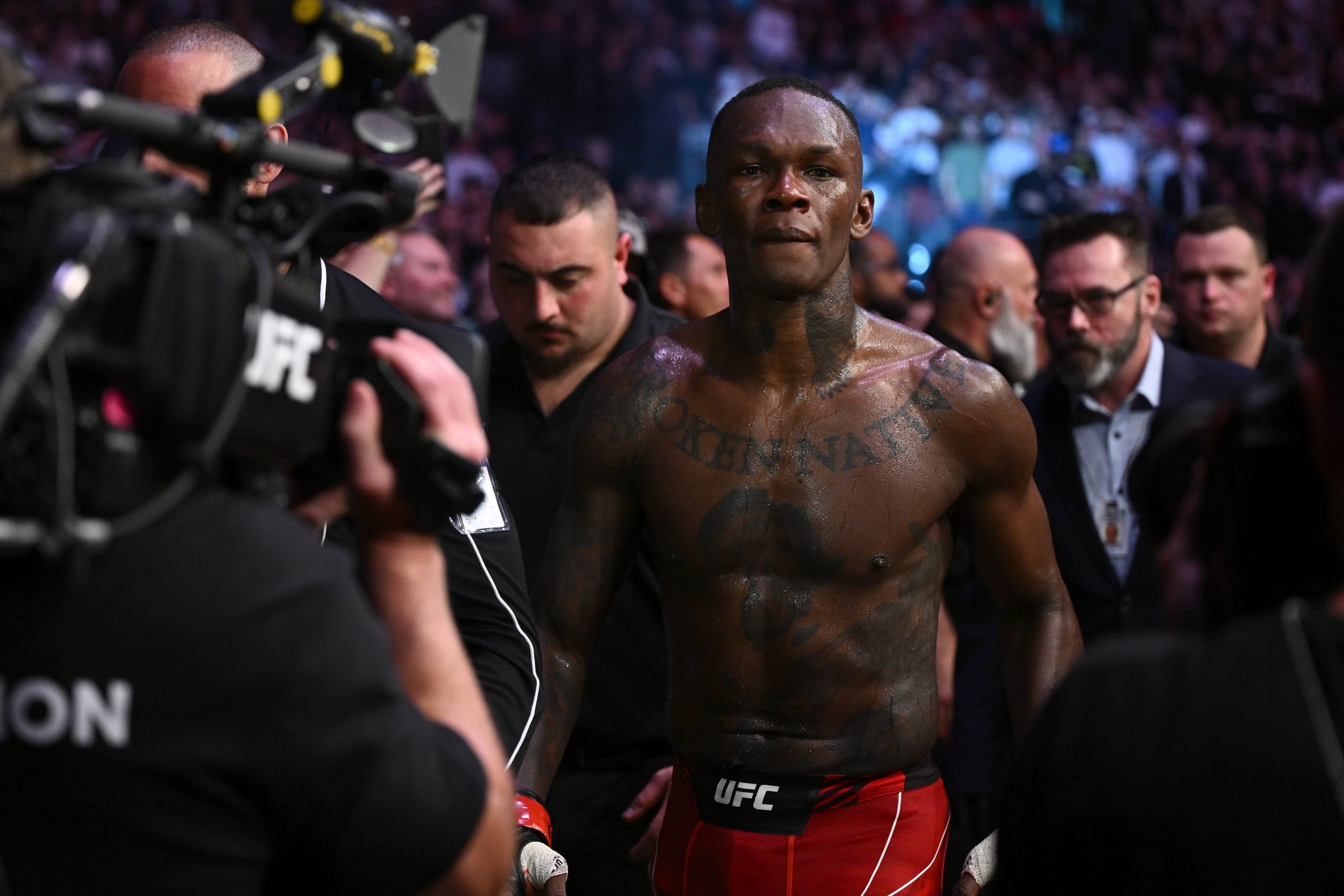 Israel Adesanya of Nigeria leaves the octagon after being defeated by Sean Strickland of the USA during the Middleweight Title bout of UFC 293 at Q...