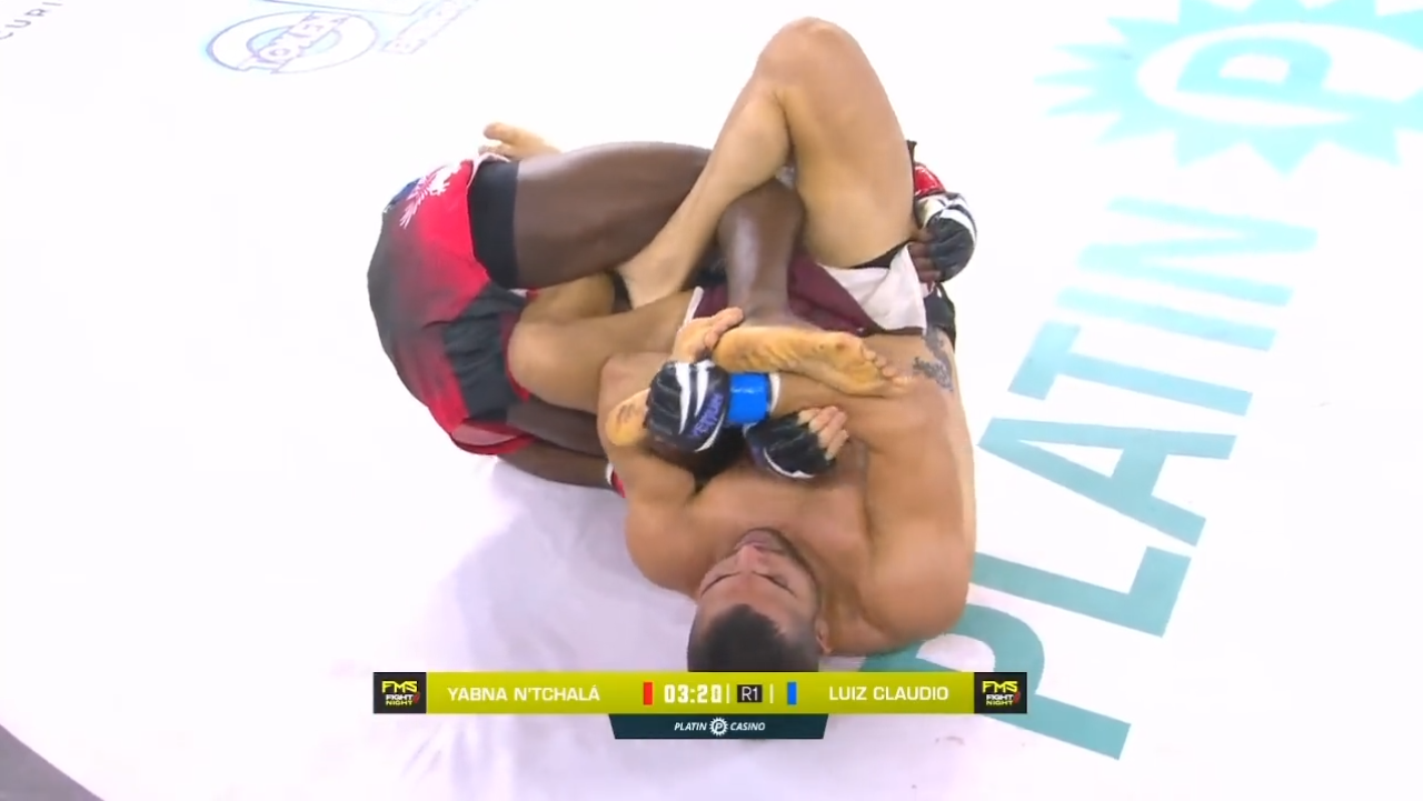 MMA Fighter Luiz Claudio goes for a heel hook.