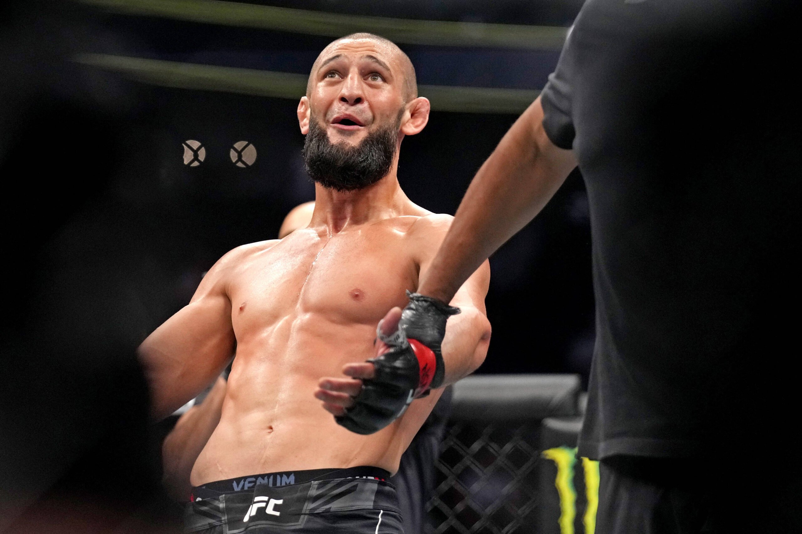 Khamzat Chimaev (red gloves) fights Kevin Holland (blue gloves) during UFC 279 at T-Mobile Arena. Mandatory Credit: Joe Camporeale-USA TODAY Sports...