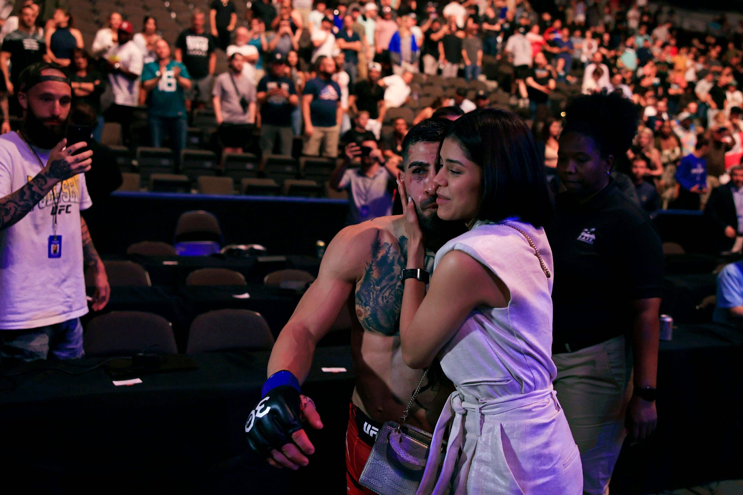 Syndication: Florida Times-Union Ilia Topuria walks away with girlfriend Giorgina Uzcategui after a featherweight bout during the UFC Fight Night e...