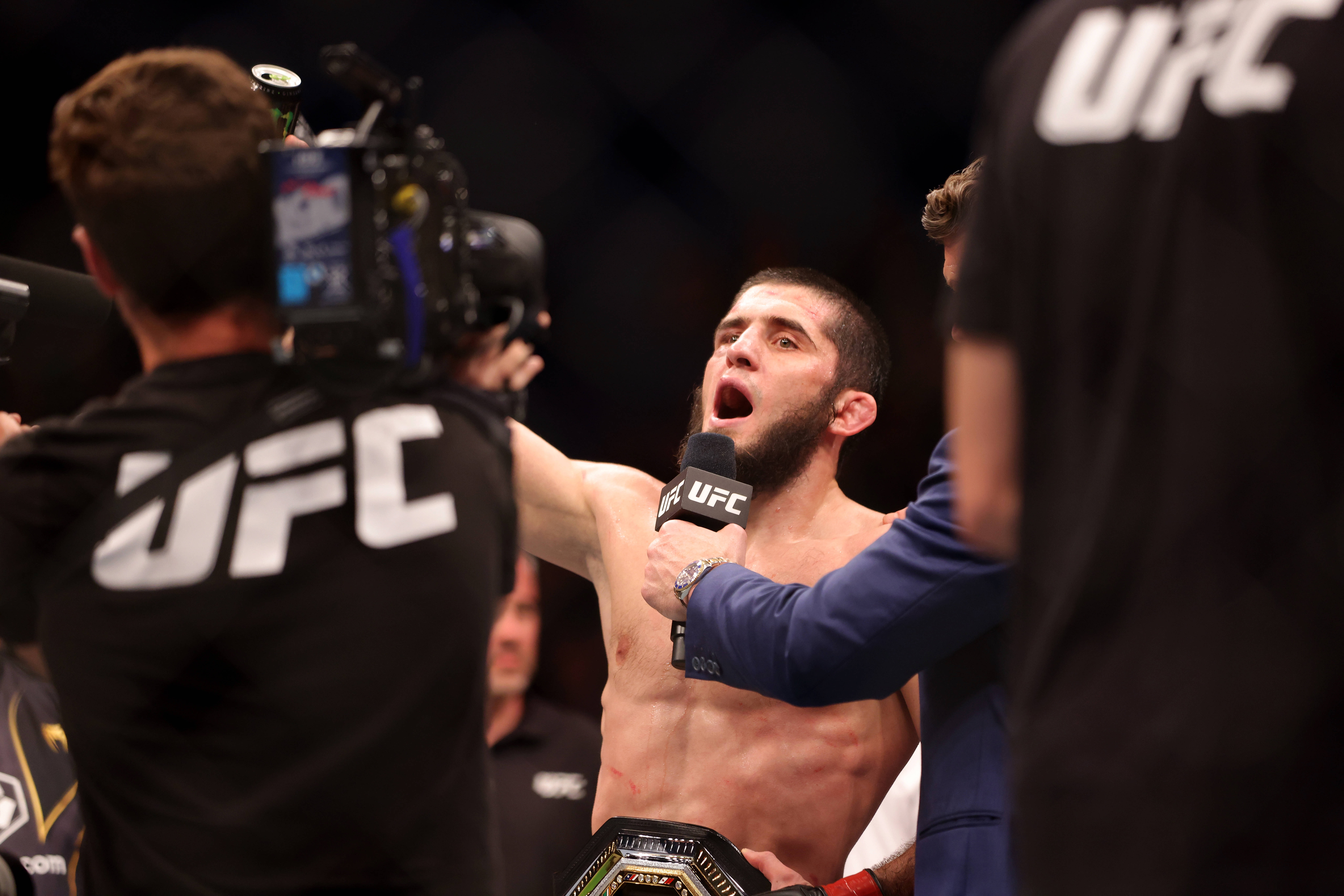 UFC 294 Islam Makhachev celebrates his win over Alexander Volkanovski.