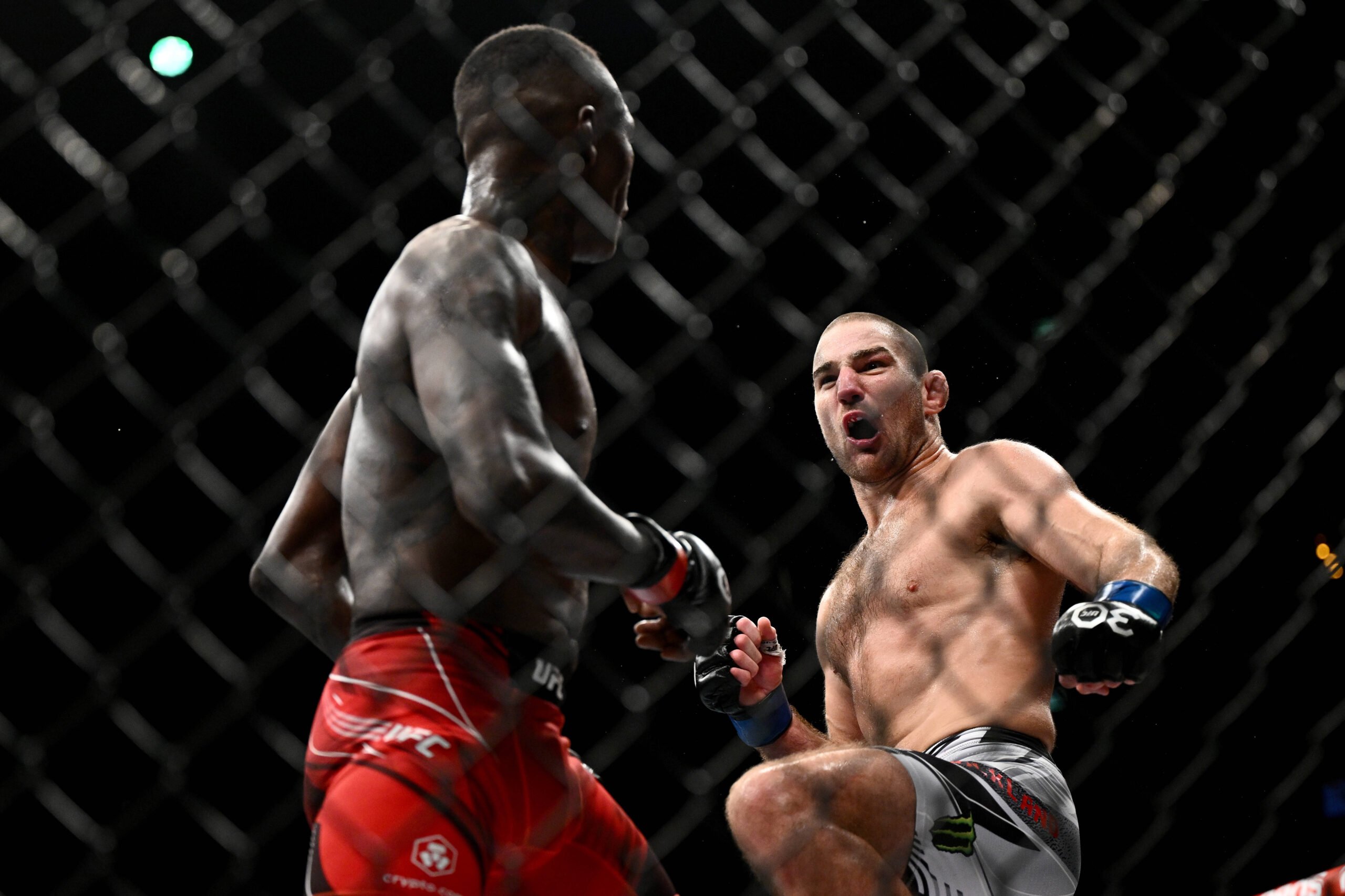 UFC 293 SYDNEY, Israel Adesanya of Nigeria (left) and Sean Strickland of the USA during the Middleweight Title bout of UFC 293 at Qudos Bank Arena ...