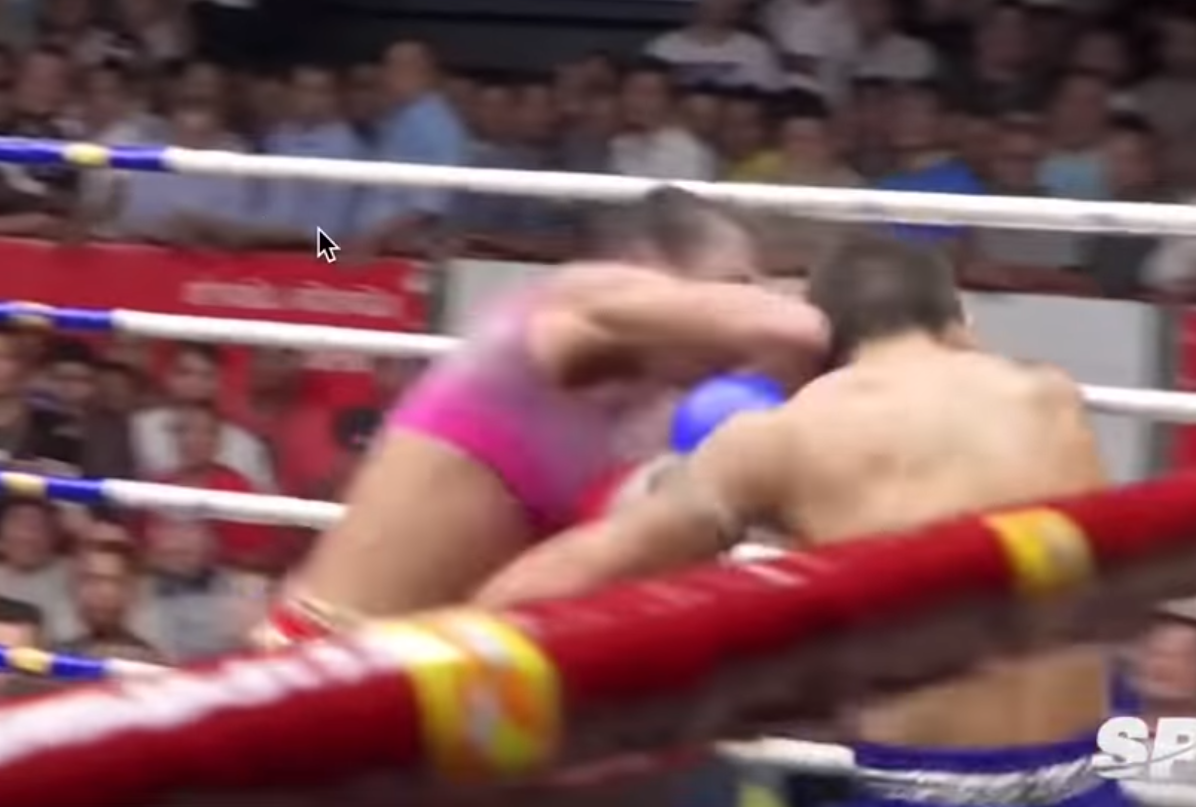 Muay Thai fighter Nong Rose lands another flush elbow in a match