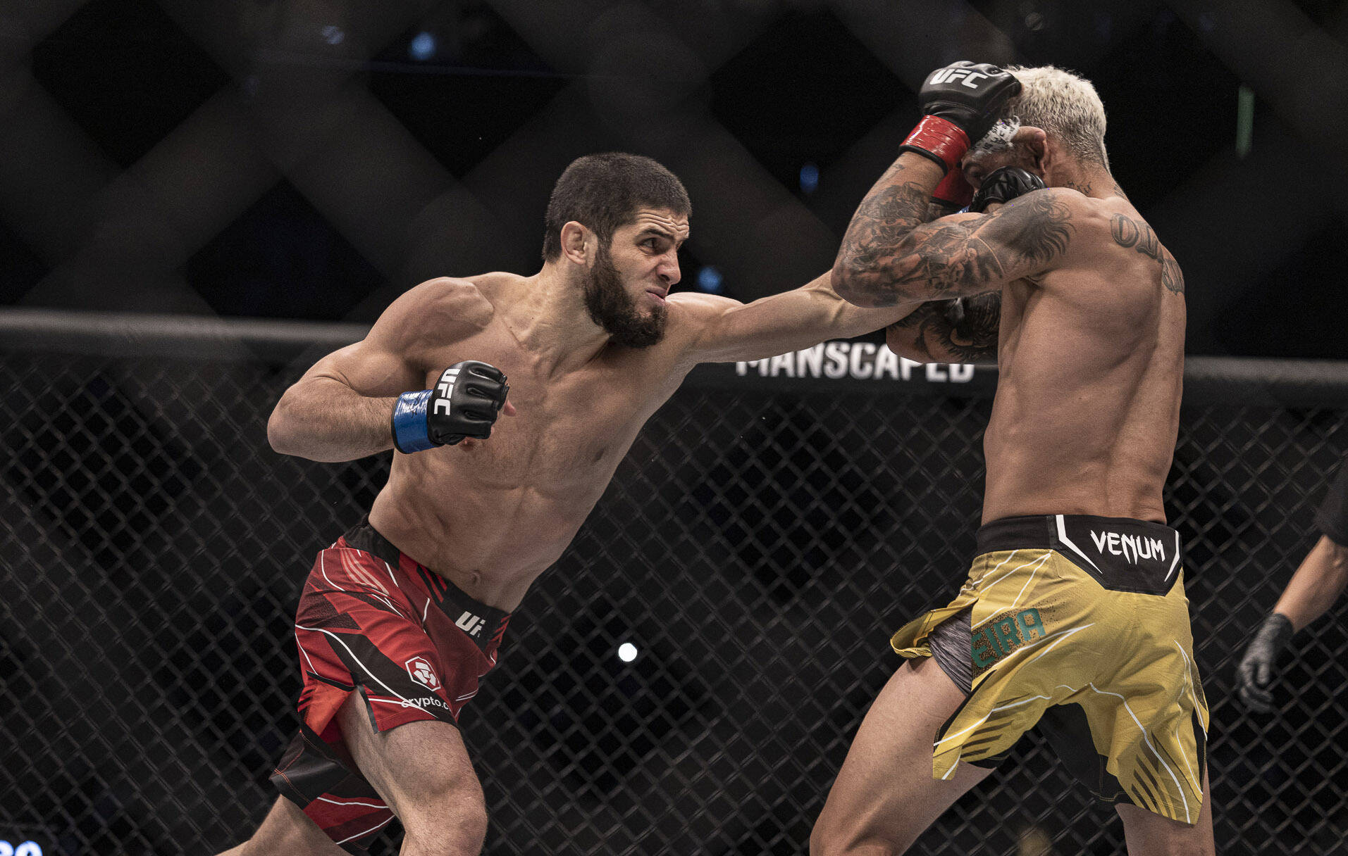 MMA: UFC 280-Oliveira vs Makhachev Oct 22, 2022; Abu Dhabi, UAE; Charles Oliveira (red gloves) and Islam Makhachev (blue gloves) during UFC 280 at ...
