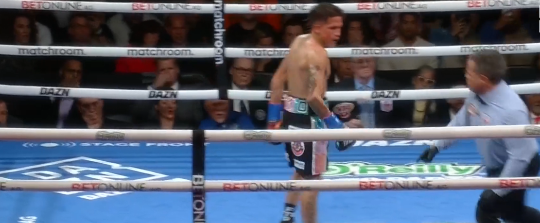Bam Rodriguez stands over Sunny Edwards after a knockdown during their fight