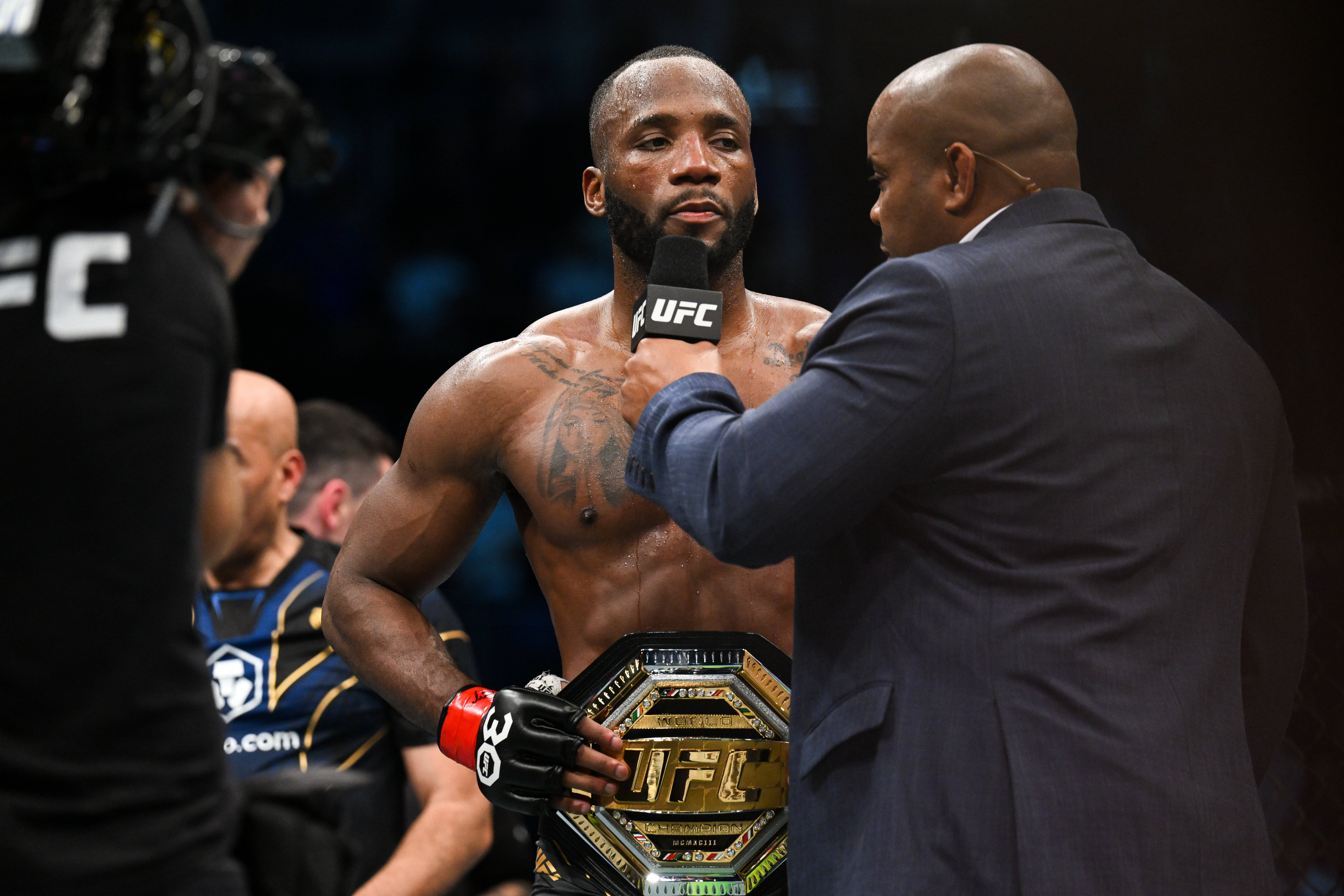 UFC 296's Leon Edwards (red gloves) speaks after defeating Kamaru Usman (not pictured) during UFC 286 at O2 Arena.