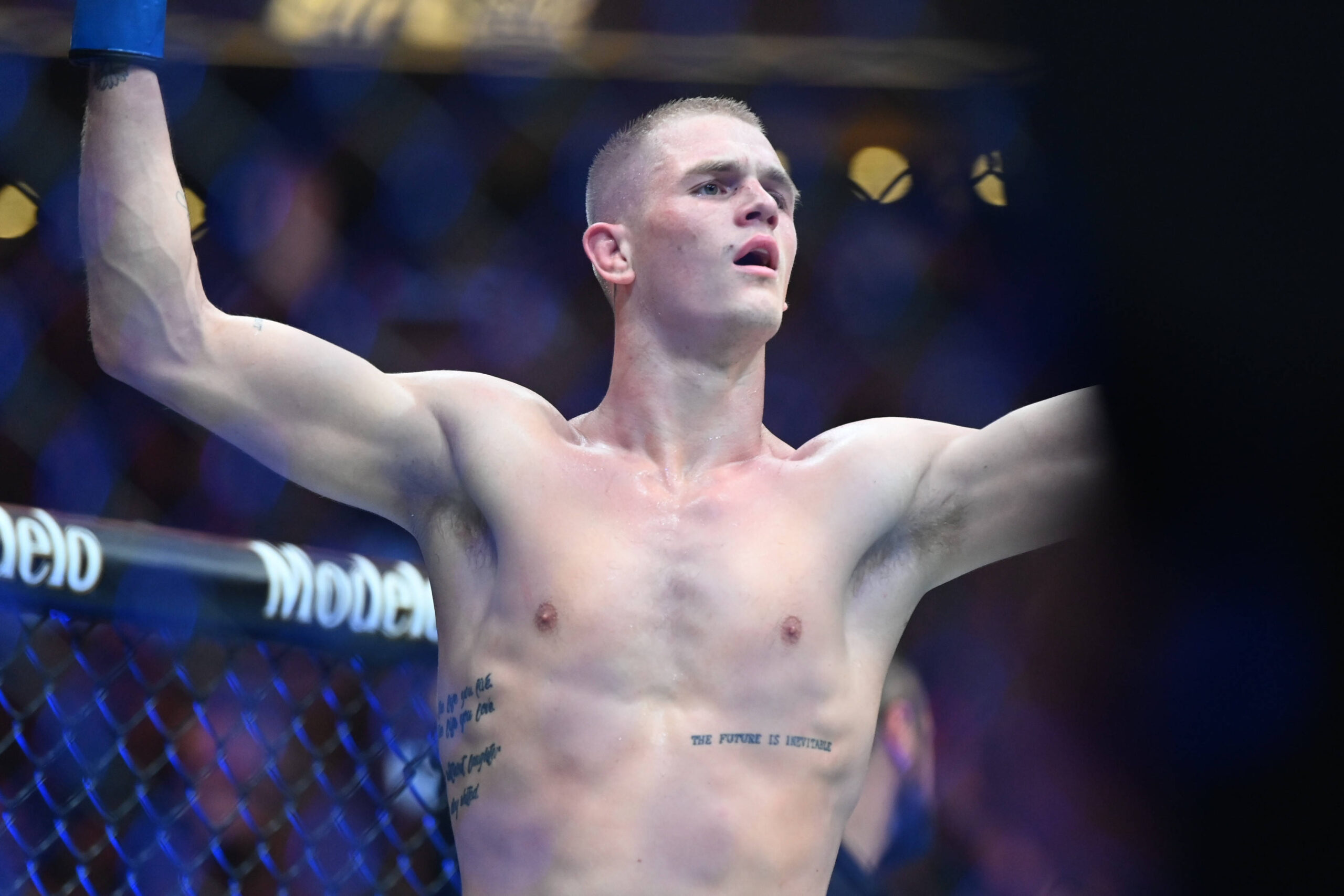 MMA: UFC 292 - Magny vs Garry Aug 19, 2023; Boston, MA, USA; Ian Garry (blue gloves) reacts to defeating Nail Magny (red gloves) during UFC 292 at ...