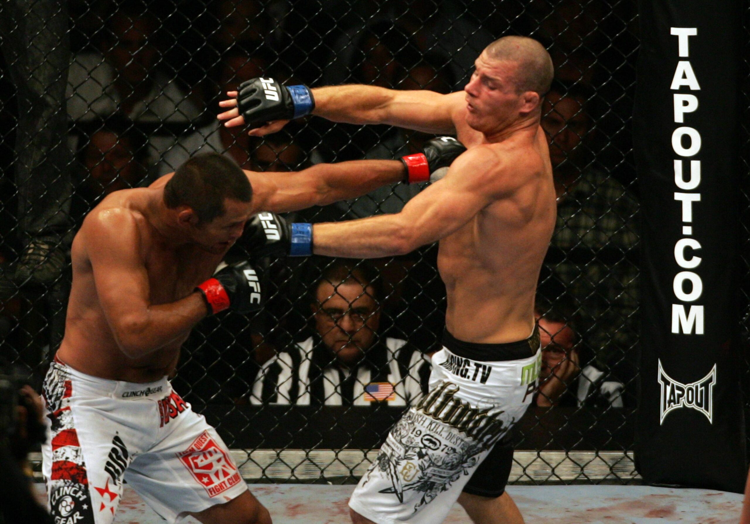 11 July 2009: Dan Henderson on left and Michael Bisping of Britain exchange punches during their middleweight fight at the UFC 100 event at the Man...