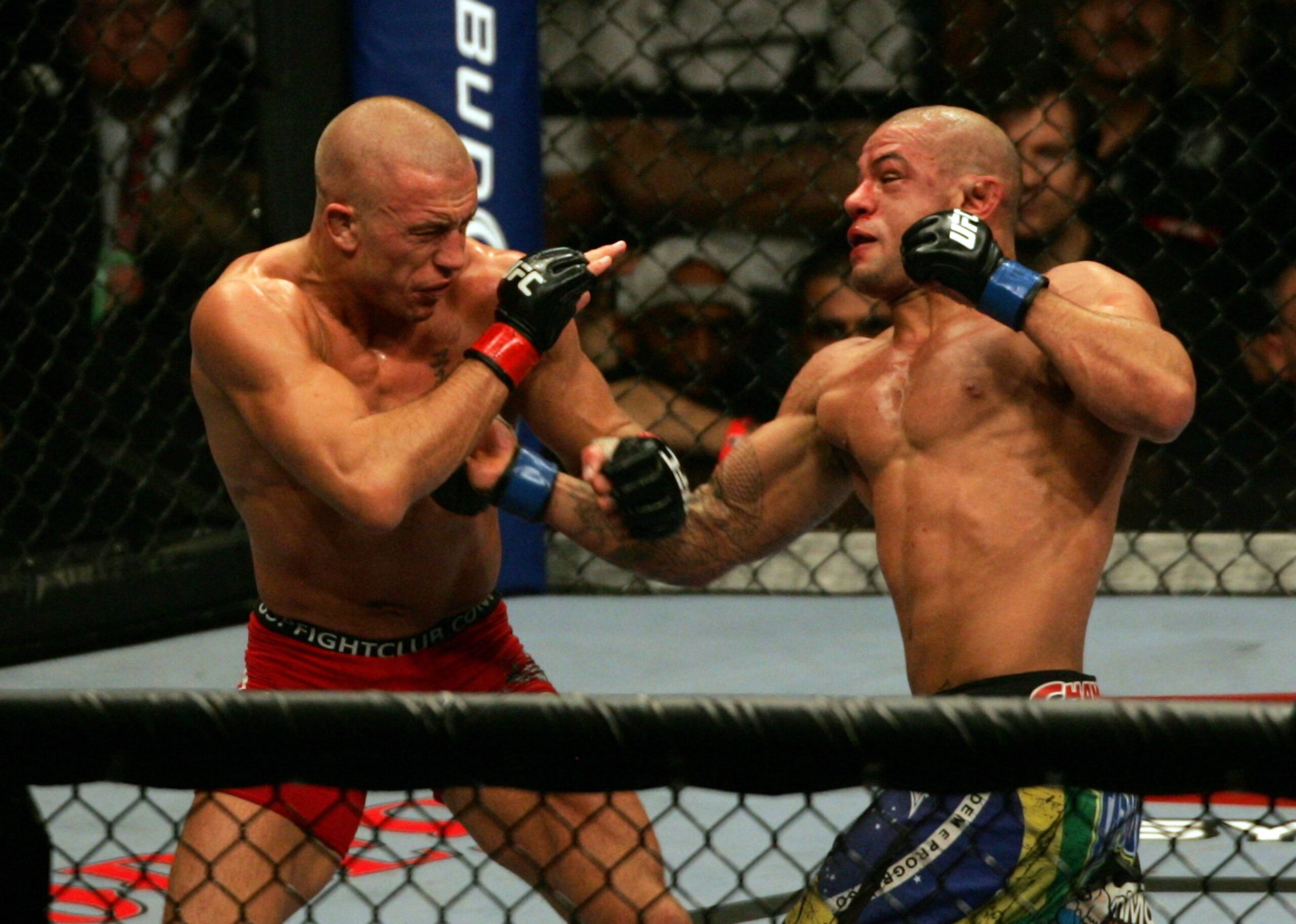 11 July 2009: Georges St-Pierre of Canada on left and Thiago Alves of Brazil exchange punches during their welterweight fight at the UFC 100 event ...