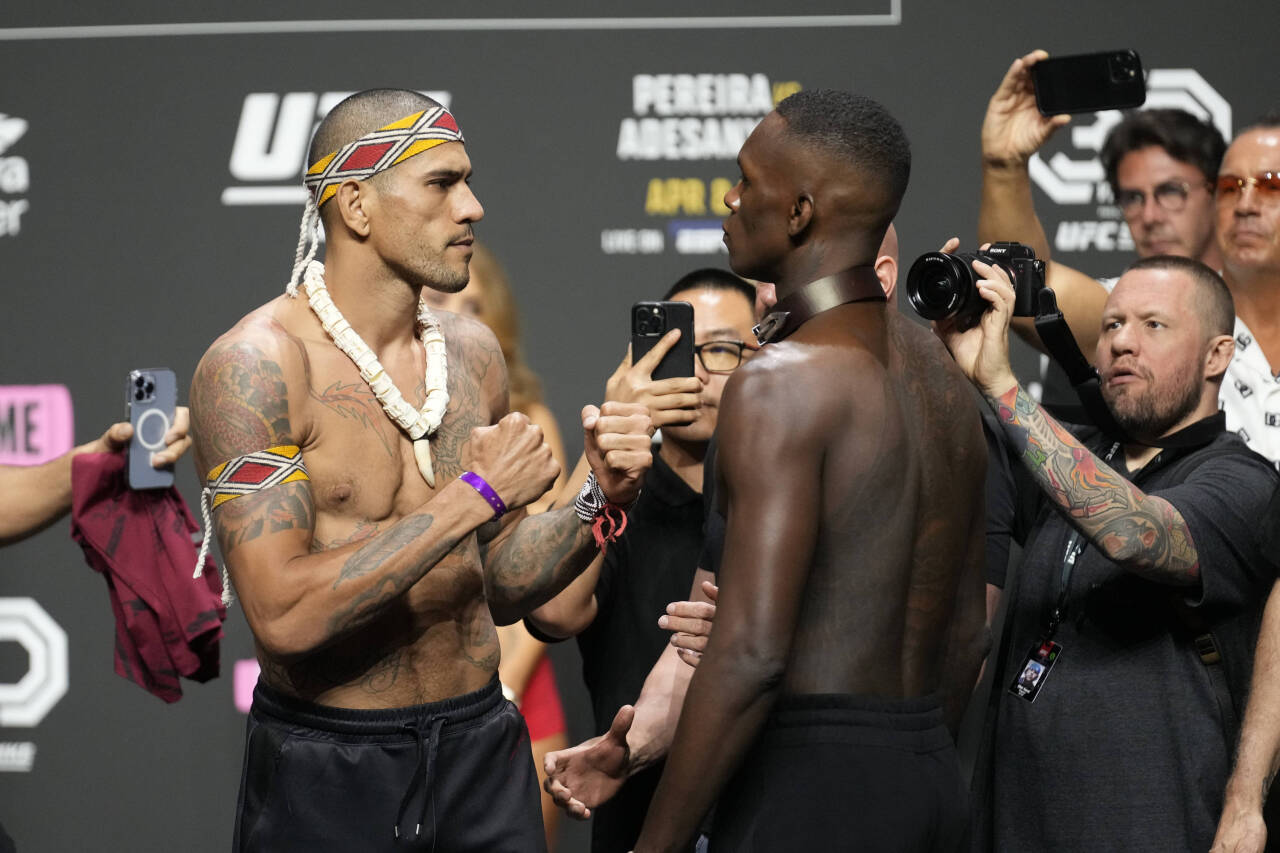 April 7, 2023, Miami, Florida, MIAMI, FLORIDA, United States: MIAMI, FLORIDA -April 7: (L-R) Alex Pereira and Israel Adesanya face-off following th...