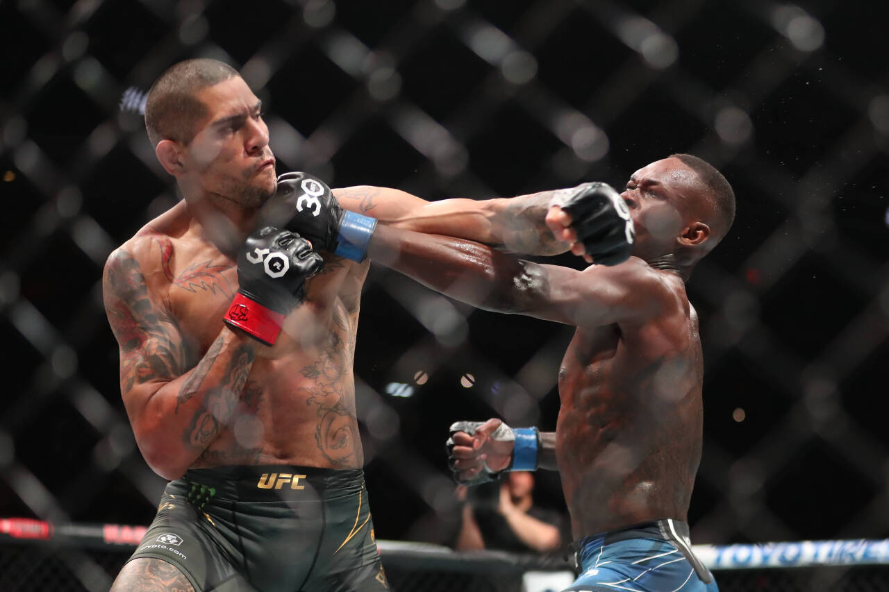 April 8, 2023, Miami, FL, Miami, Florida, United States: MIAMI, FLORIDA - APRIL 8: (L-R) Alex Pereira punches Israel Adesanya in their middleweight...