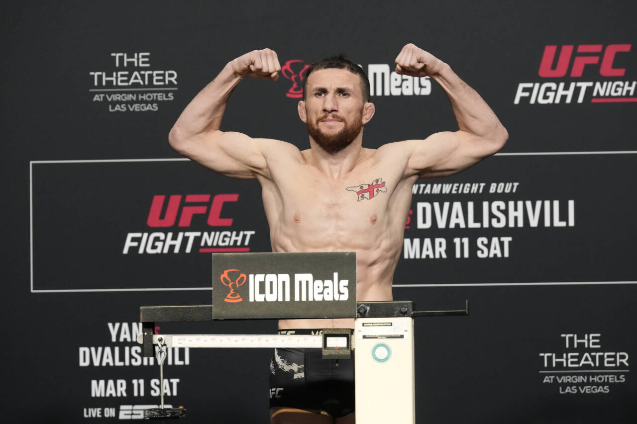March 10, 2023, Las Vegas, NV, LAS VEGAS, NV, United States: LAS VEGAS, NV - MARCH 10: Merab Dvalishvili steps on the scale for the official weigh-...