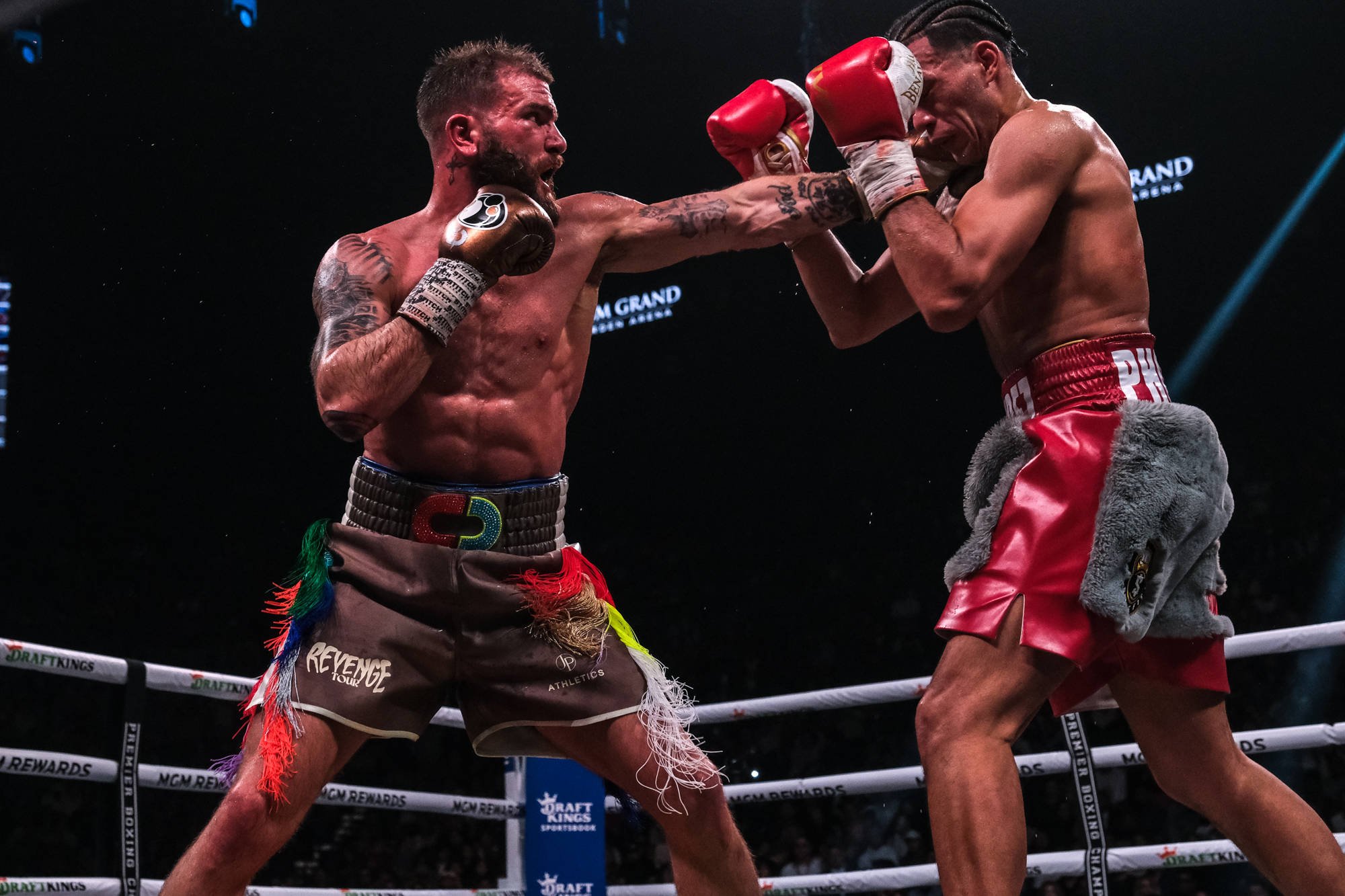 March 25, 2023, Las Vegas, Nevada, USA: Action between David Benavidez (gray and red shorts) and Caleb Plant in their WBC Super Middleweight Title ...
