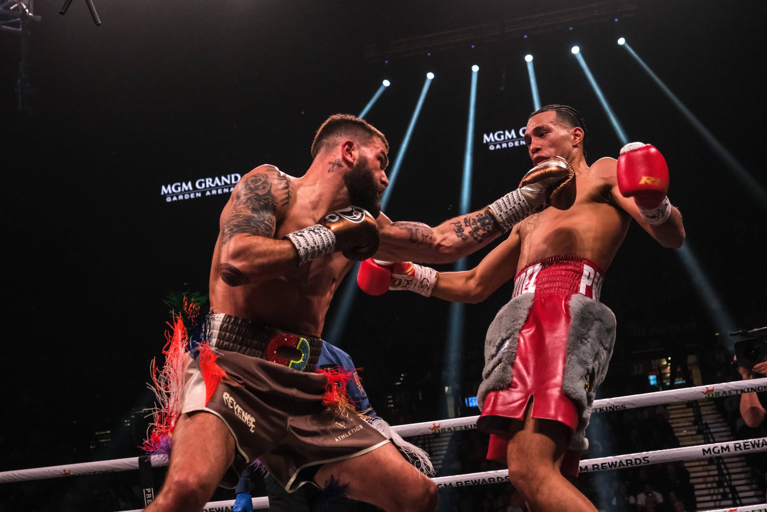 March 25, 2023, Las Vegas, Nevada, USA: Action between David Benavidez (gray and red shorts) and Caleb Plant in their WBC Super Middleweight Title ...