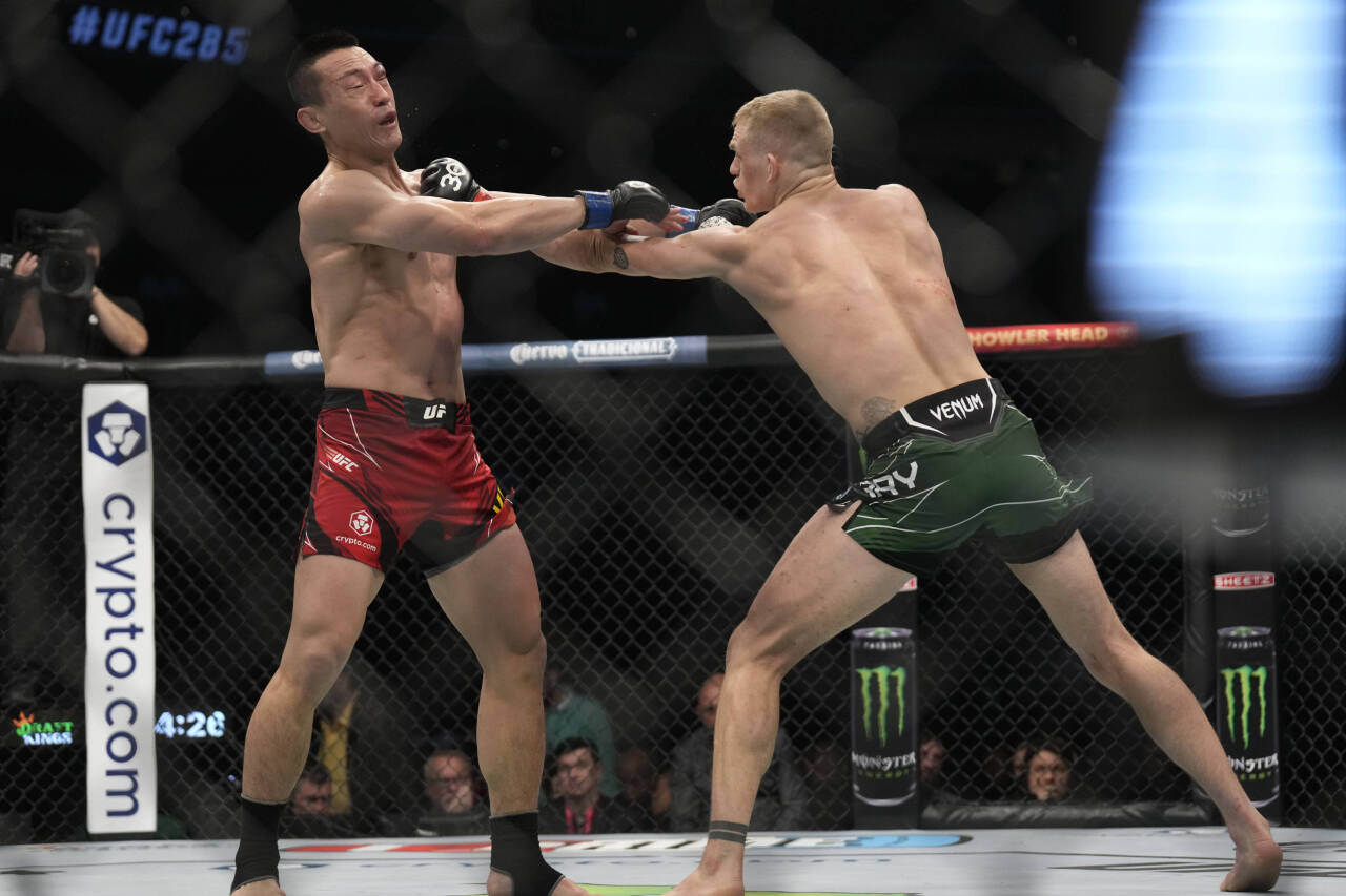 March 4, 2023, Las Vegas, NV, LAS VEGAS, NV, USA: LAS VEGAS, NV - MARCH 4: (R-L) Ian Garry punches Kenan Song in their Welterweight fight during th...