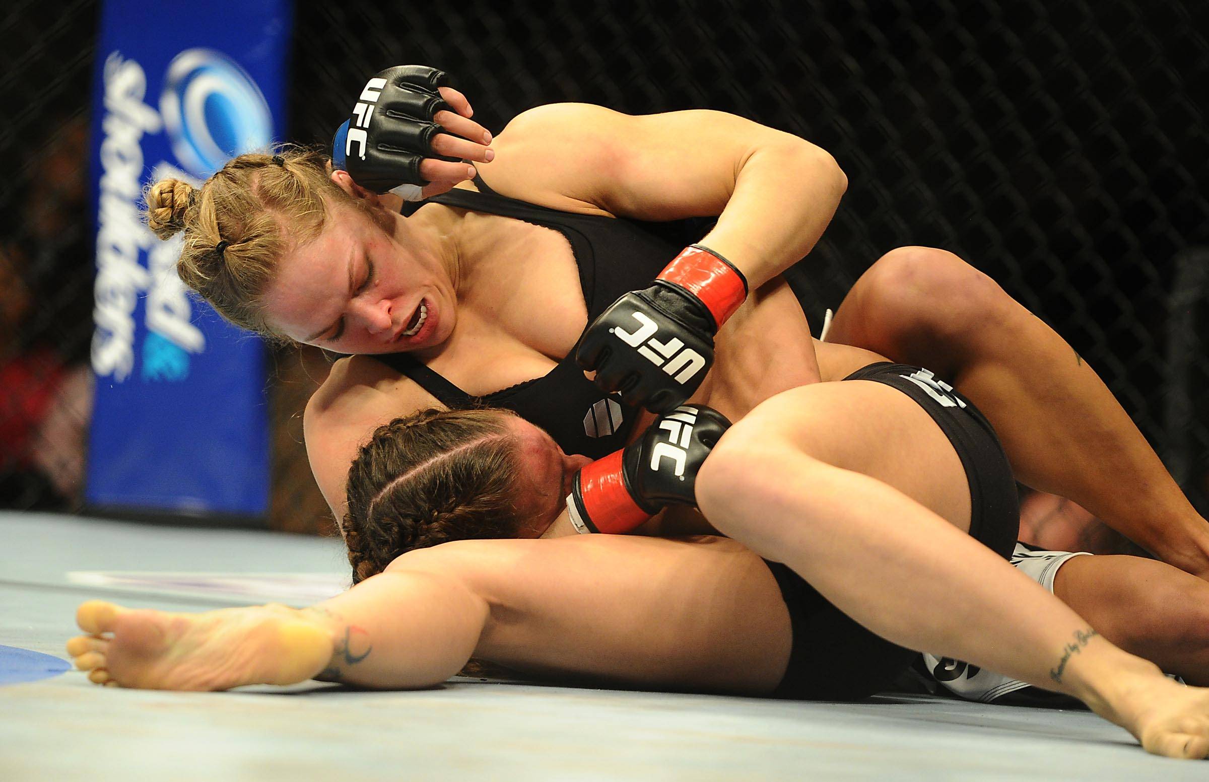 MMA: UFC 157-Rousey vs Carmouche Feb 23, 2013; Anaheim, CA, USA; Ronda Rousey (black shorts) and Liz Carmouche (white shorts) fight during their UF...