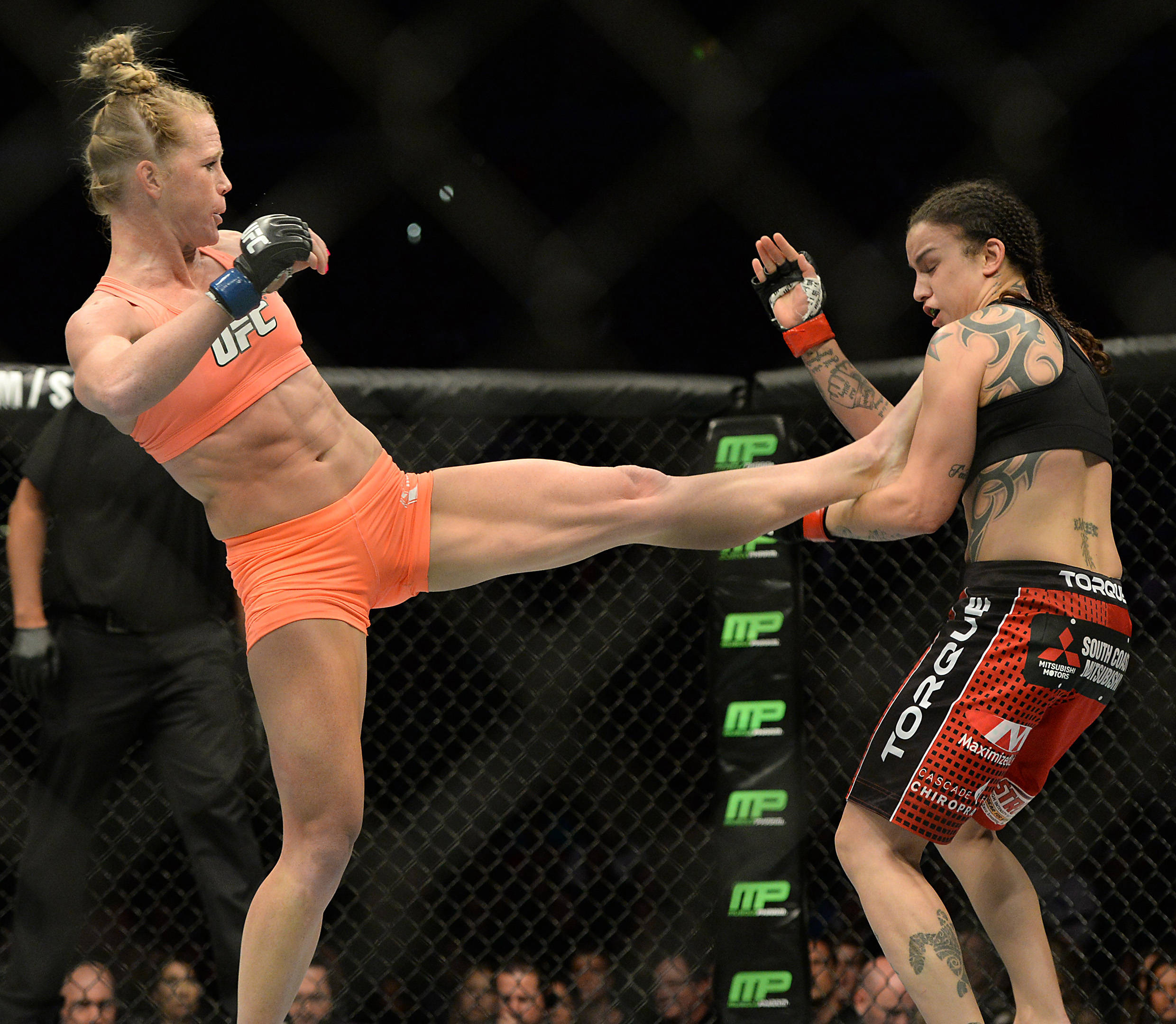 MMA: UFC 184-Pennington vs Holm Feb 28, 2015; Los Angeles, CA, USA; Raquel Pennington (red gloves) and Holly Holm (blue gloves) during their Women ...