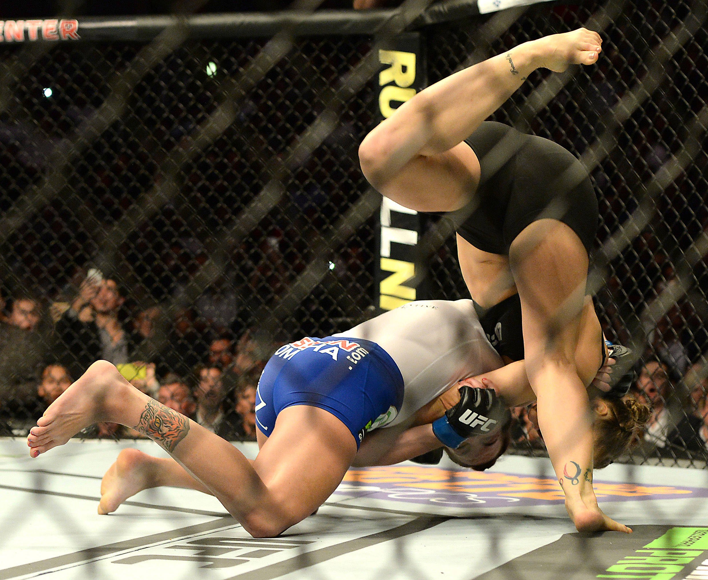 MMA: UFC 184-Rousey vs Zingano Feb 28, 2015; Los Angeles, CA, USA; Ronda Rousey (red gloves) and Cat Zingano (blue gloves) during their women s ban...